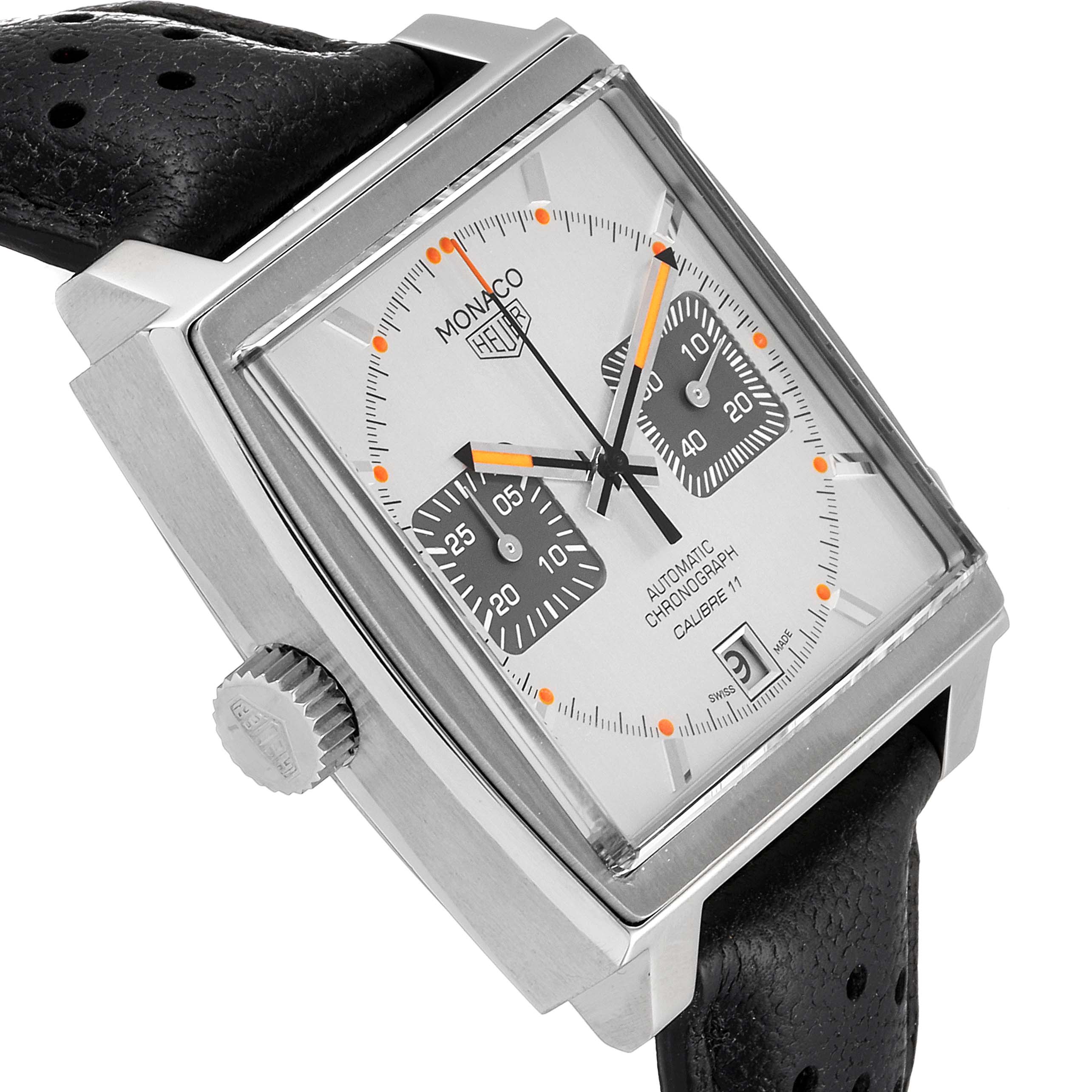 The image shows a side-angle view of the Tag Heuer Monaco watch, highlighting its face, bezel, crown, and part of the strap.