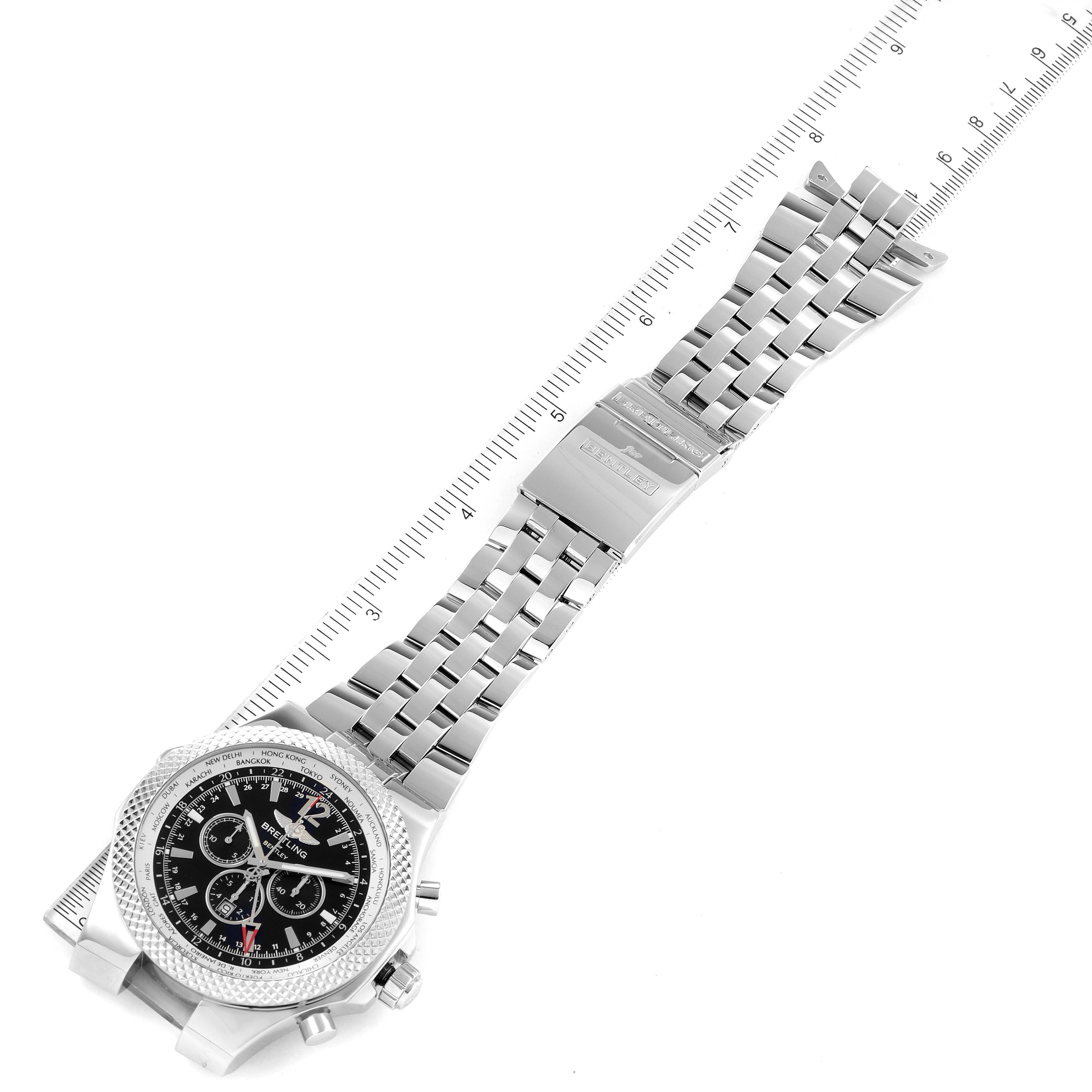 The Breitling Bentley A47362 Men's Stainless Steel Black Dial A47362 Men's Stainless Steel Black Dial watch is shown from an overhead angle, displaying its face, metal band, and a portion of a measuring ruler.