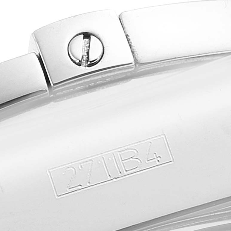 The image shows a close-up of part of the bracelet clasp of a Breitling Chronomat AB0140 Men's Stainless Steel Silver Dial AB0140 Men's Stainless Steel Silver Dial watch, including a screw and a stamped code.