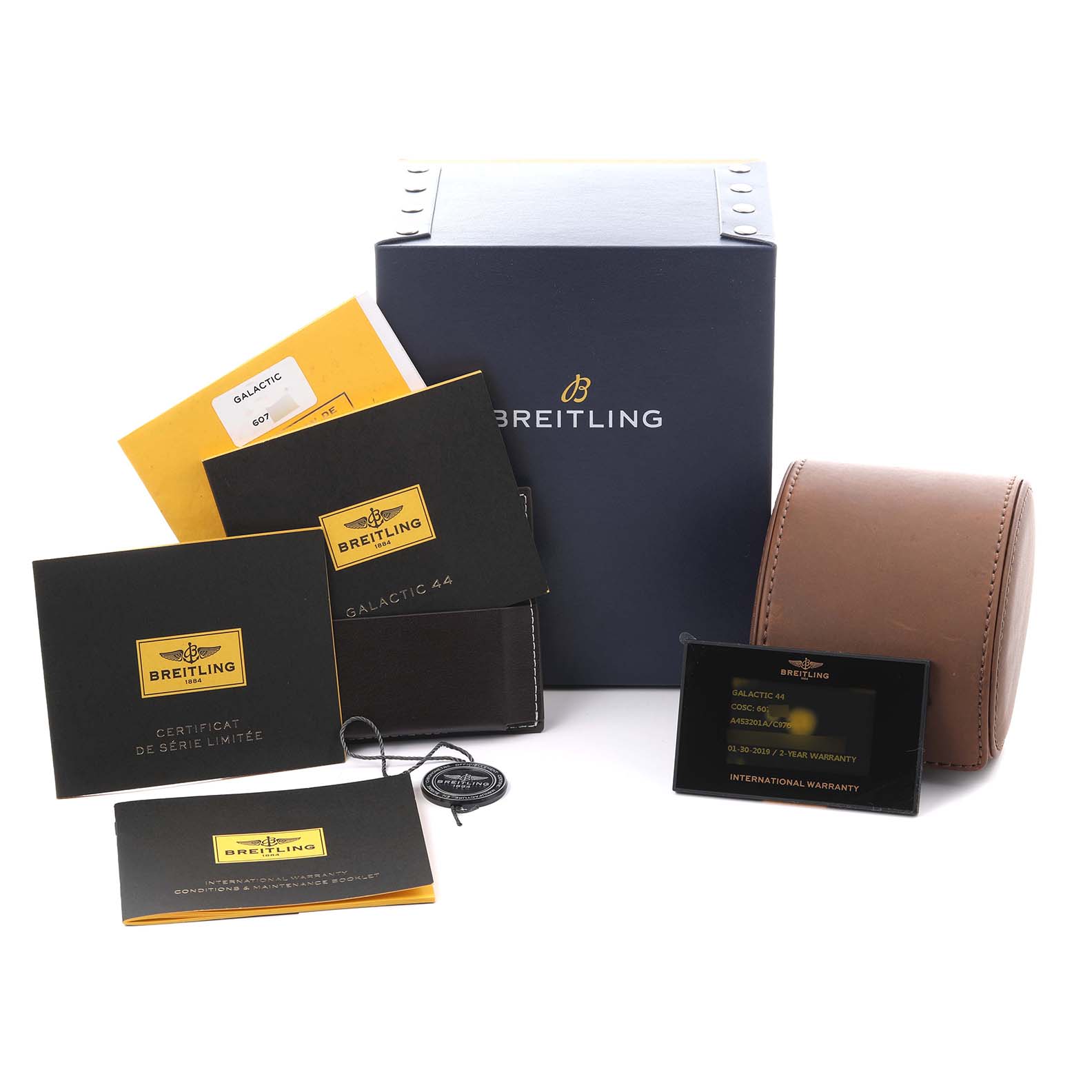 The image shows accessories for a Breitling Galactic A45320 Men's Stainless Steel Blue Dial A45320 Men's Stainless Steel Blue Dial model, including a box, travel case, certificates, and warranty.