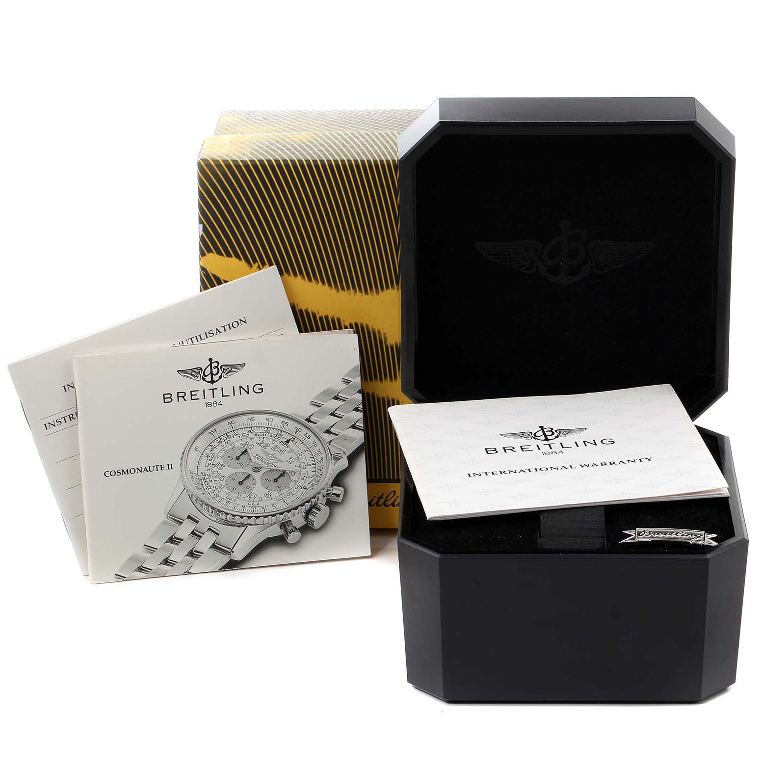 The image shows the packaging, manual, and warranty booklet for a Breitling Navitimer D12022 Men's Steel and Gold (two tone) Black Dial D12022 Men's Steel and Gold (two tone) Black Dial watch, along with the box.