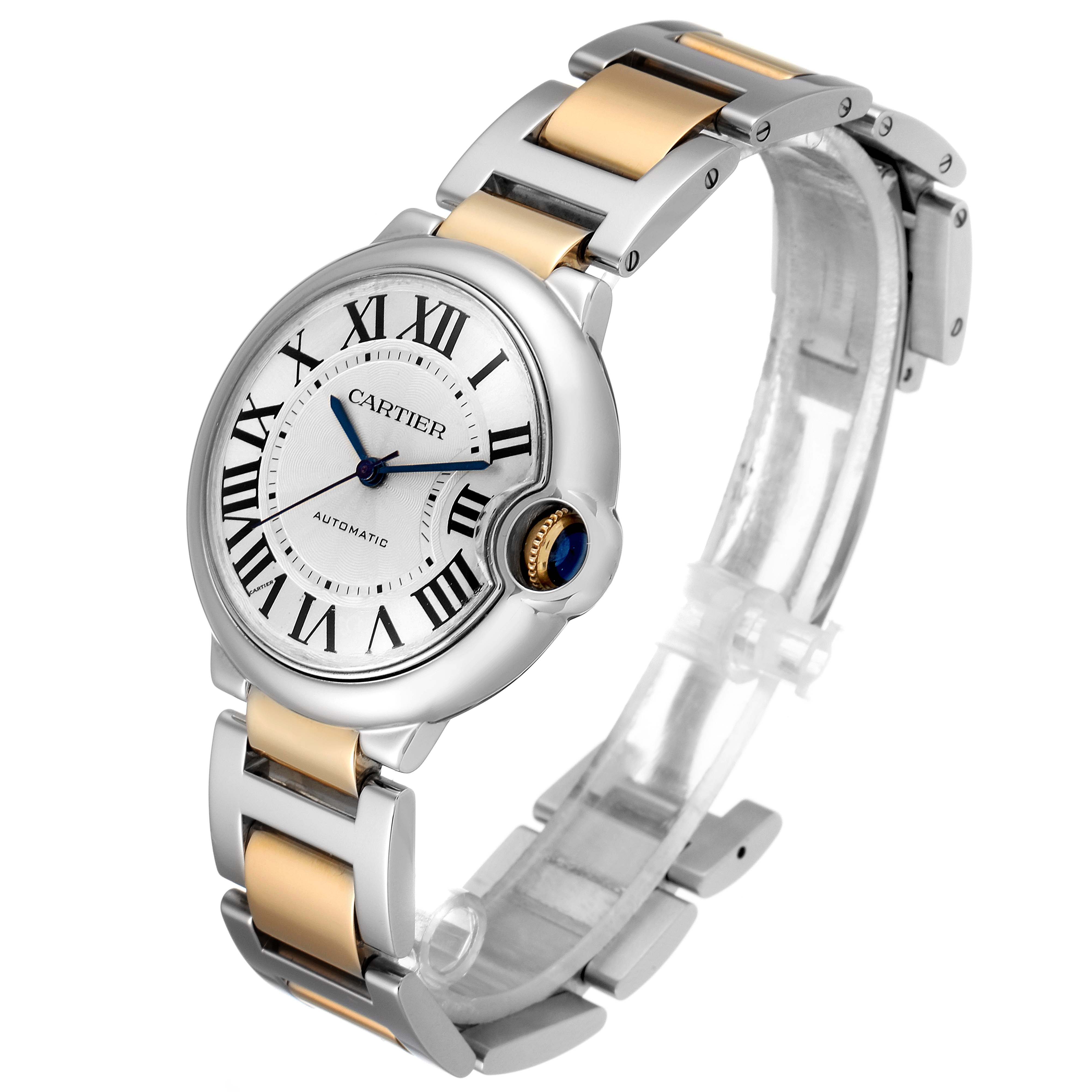 The image shows a Ballon Bleu de Cartier watch from an angled side view, highlighting the face, crown, and band.