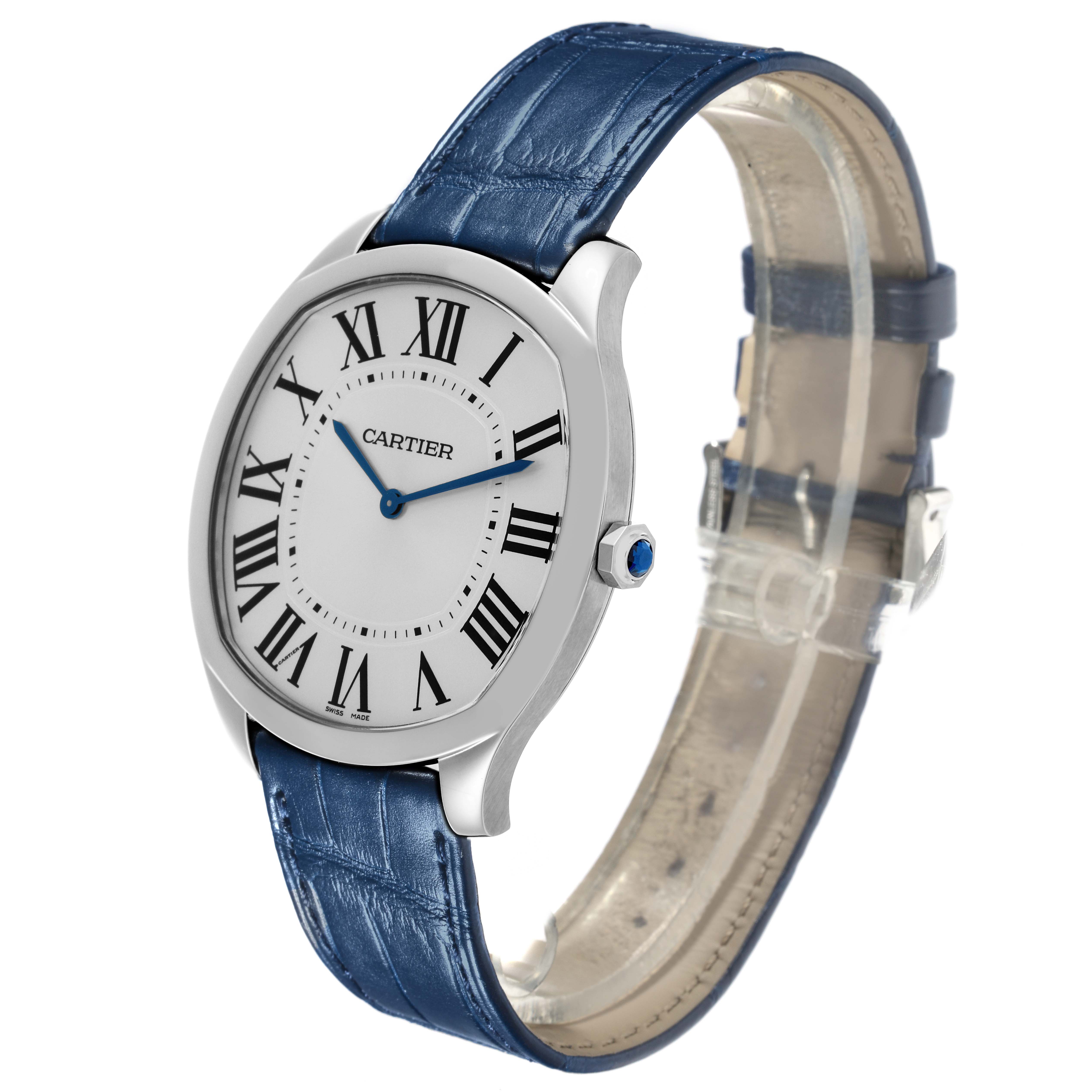 The Drive de Cartier watch is shown at a three-quarter angle, highlighting the face, blue strap, and crown.