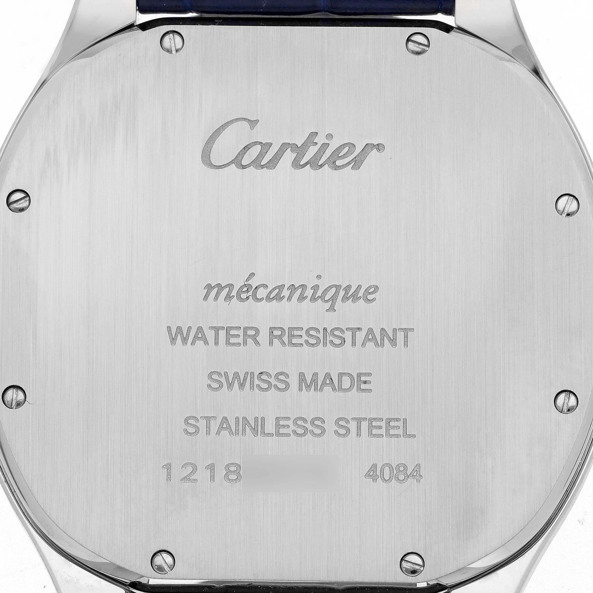 This image shows the back case of a Drive de Cartier watch by Cartier, highlighting engravings and screws.