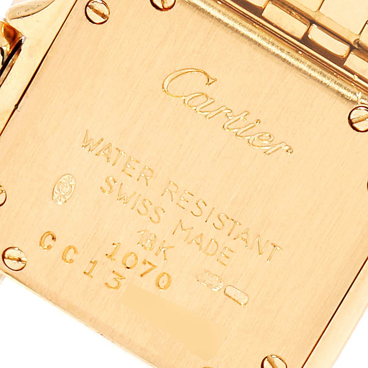 This is a close-up of the back of a gold Cartier Panthere W25022B9 Women's Yellow Gold Silver Dial W25022B9 Women's Yellow Gold Silver Dial watch, showing the engraved details.