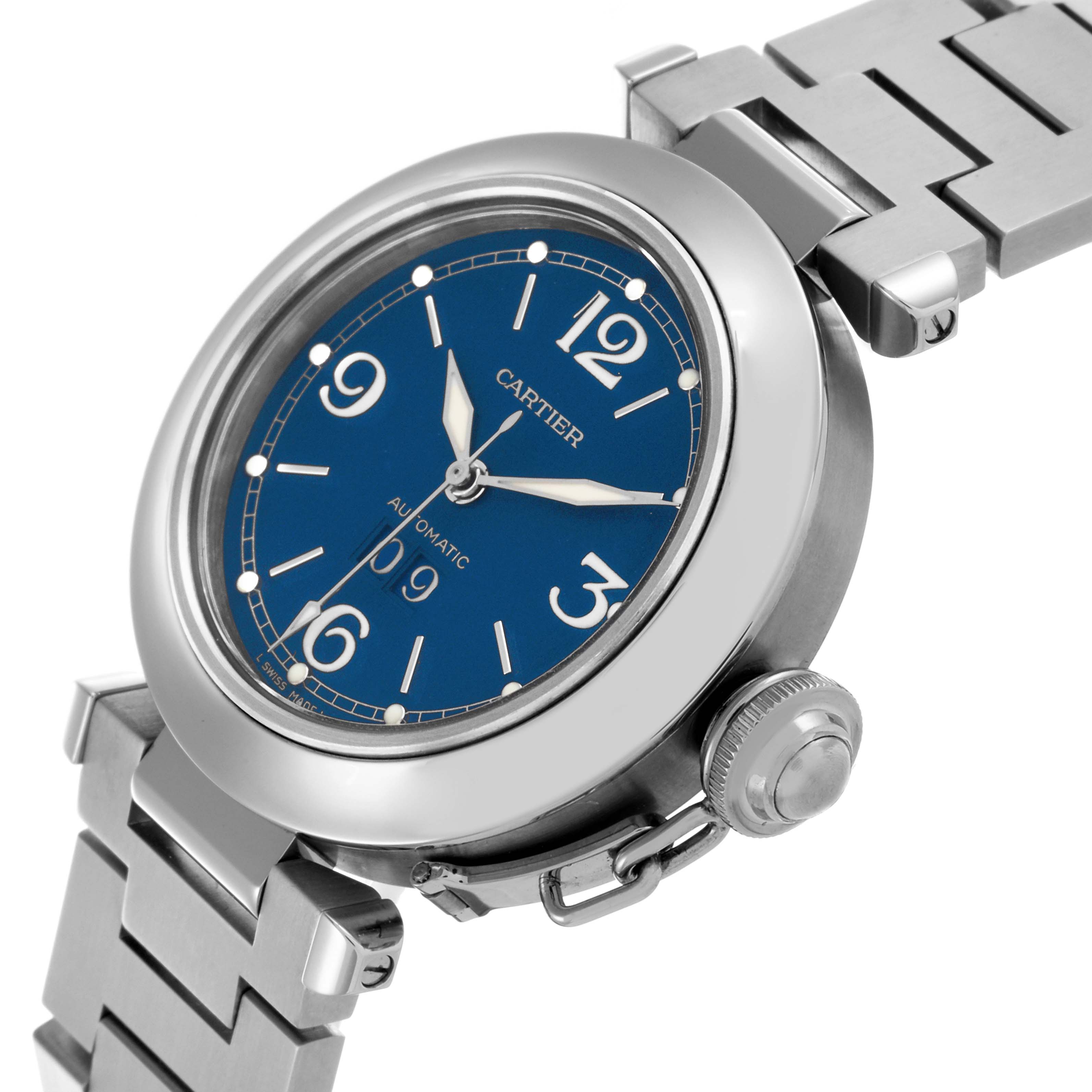 The Cartier Pasha W31047M7 Men's Stainless Steel Blue Dial W31047M7 Men's Stainless Steel Blue Dial watch is shown at an angled view, highlighting the blue dial, crown, and stainless steel bracelet.
