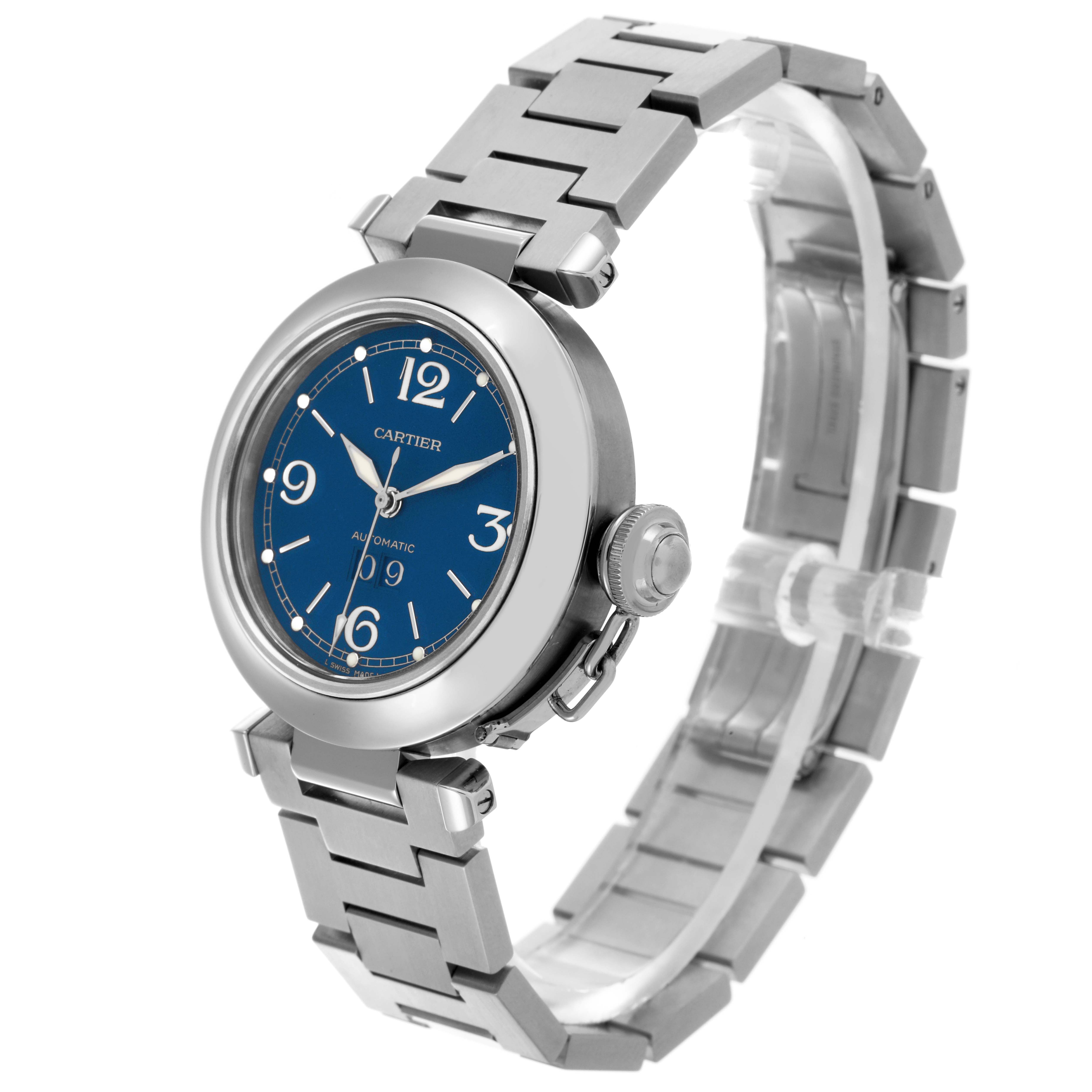 The Cartier Pasha W31047M7 Men's Stainless Steel Blue Dial W31047M7 Men's Stainless Steel Blue Dial watch is shown at a three-quarter angle, highlighting the blue dial, bezel, crown, and bracelet.