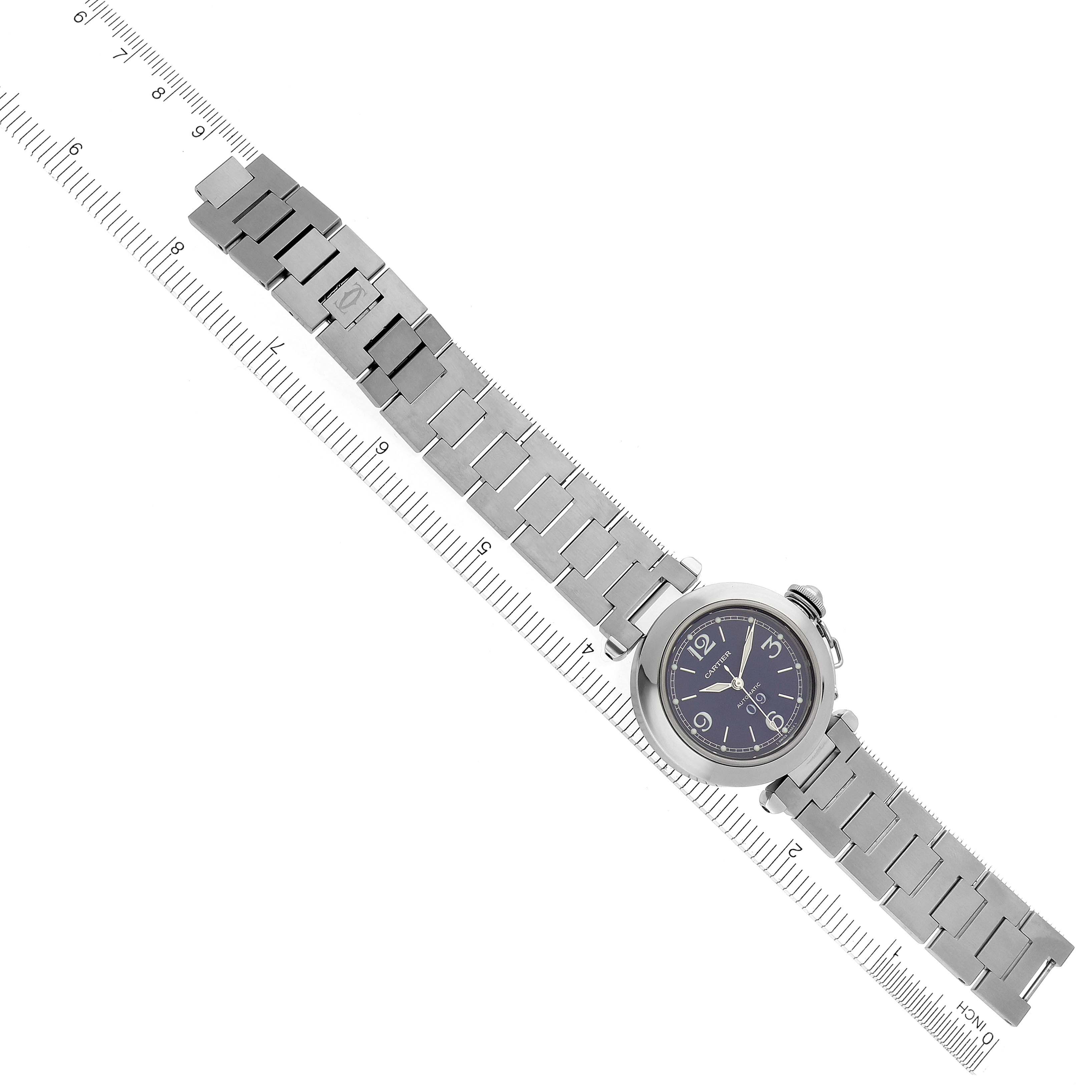 The Cartier Pasha W31047M7 Men's Stainless Steel Blue Dial W31047M7 Men's Stainless Steel Blue Dial watch is shown from a top-down angle with its full metal bracelet and round dial visible.