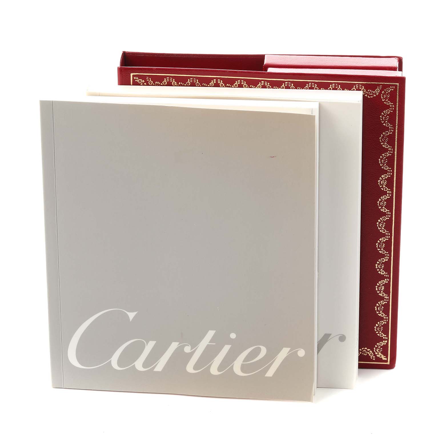 The image shows the box and booklet for the Cartier Pasha W31055M7 Men's Stainless Steel White Dial W31055M7 Men's Stainless Steel White Dial model, featuring a red and white design.