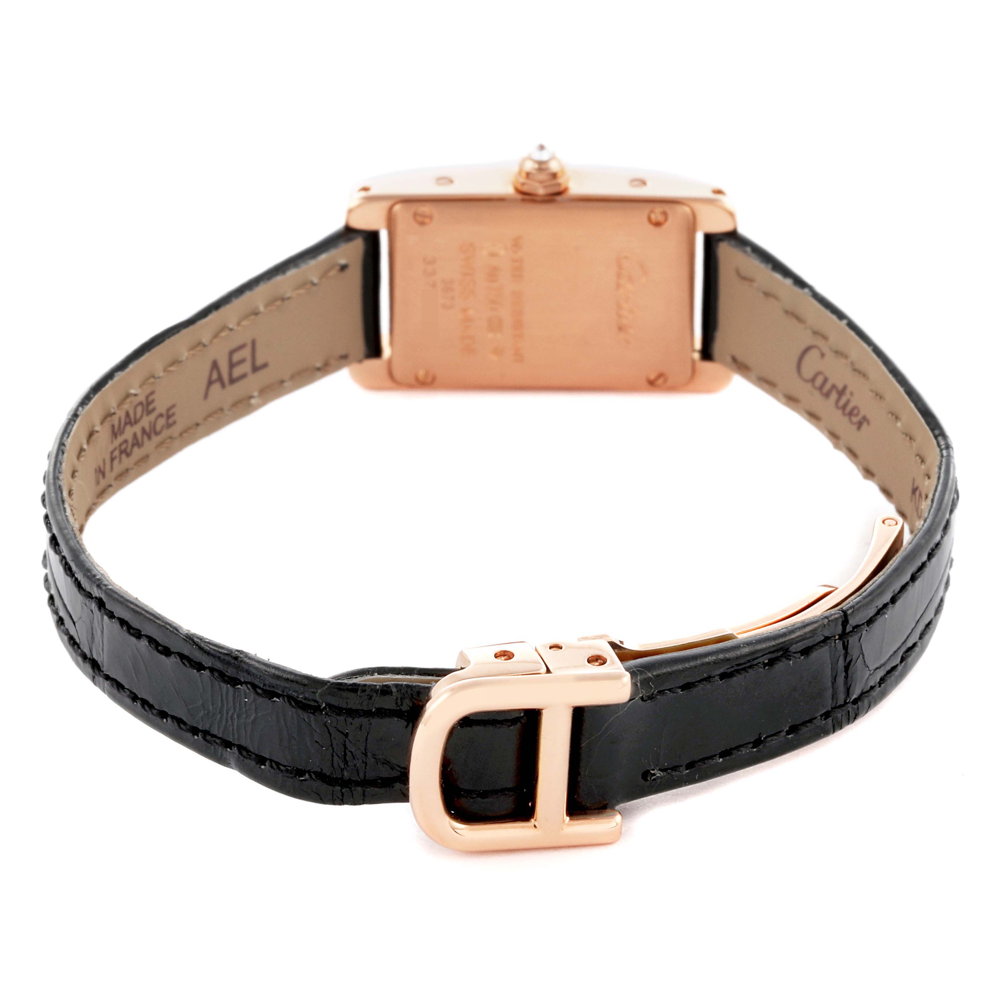 The Cartier Tank Americaine WB710014 Women's Rose Gold Silver Dial WB710014 Women's Rose Gold Silver Dial watch is shown from the back, displaying its leather strap and buckle.