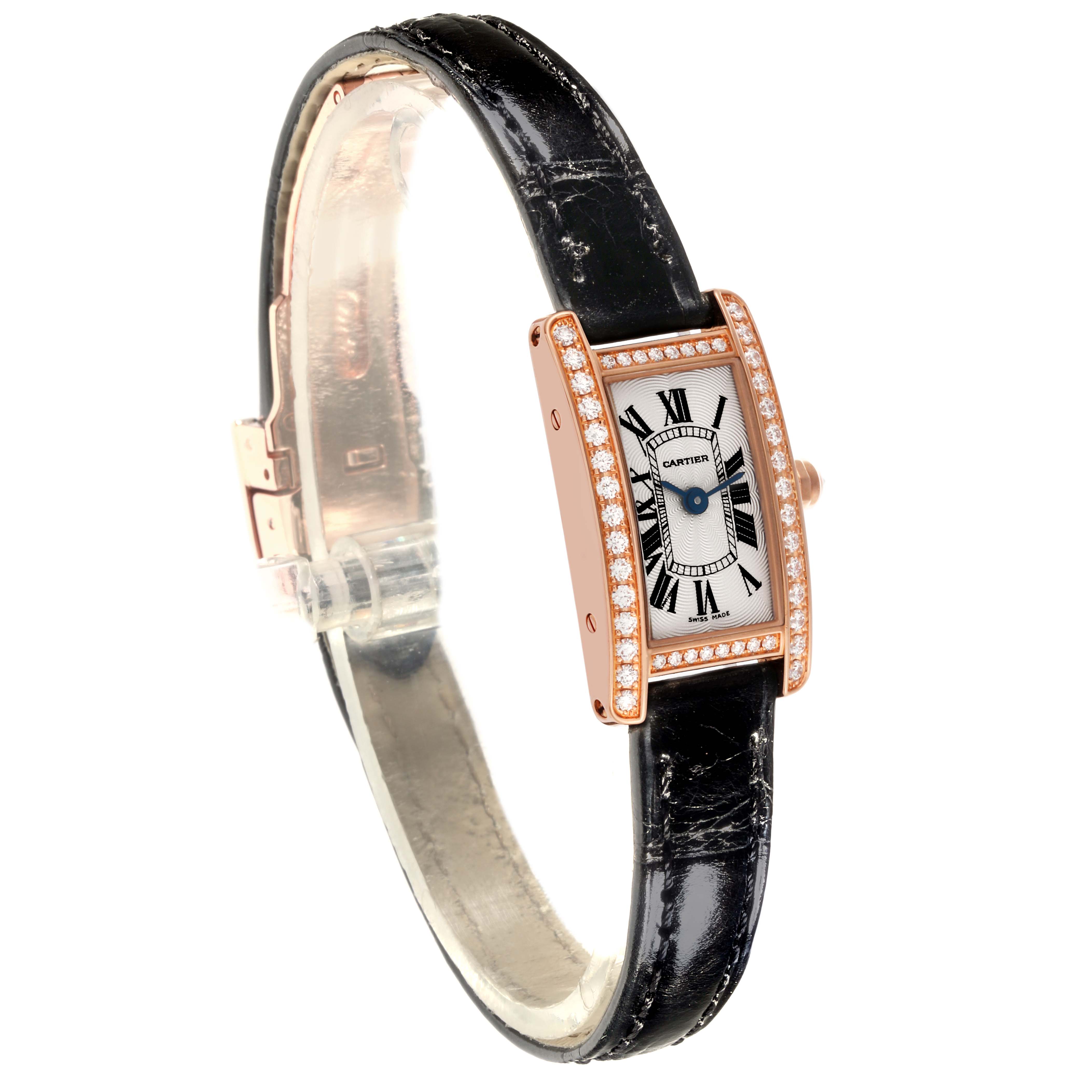 The Cartier Tank Americaine WB710014 Women's Rose Gold Silver Dial WB710014 Women's Rose Gold Silver Dial watch is shown at a three-quarter angle, highlighting the face, diamond bezel, and black leather strap.