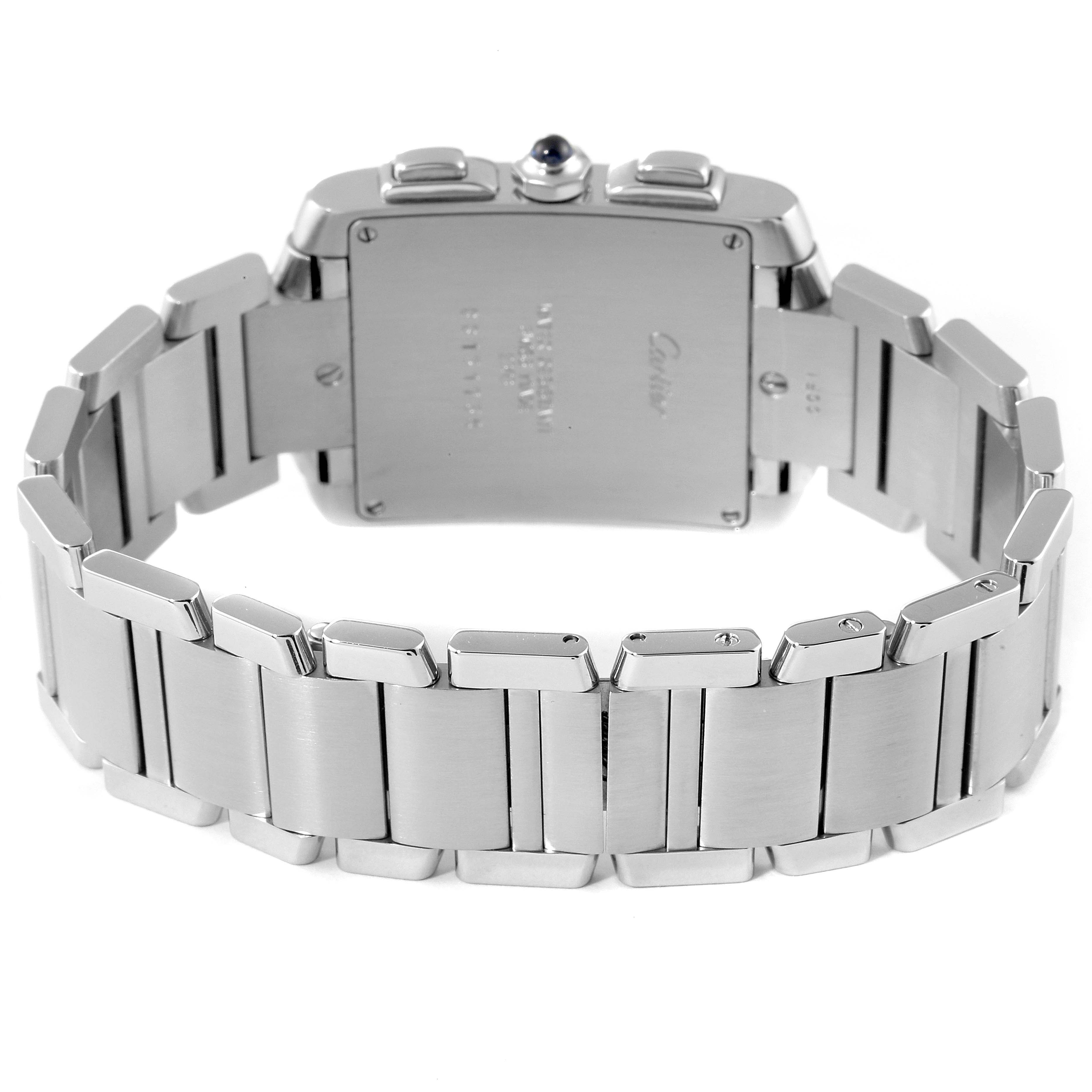 The image shows the back view of a Cartier Tank Française watch, focusing on the stainless steel bracelet and case back.