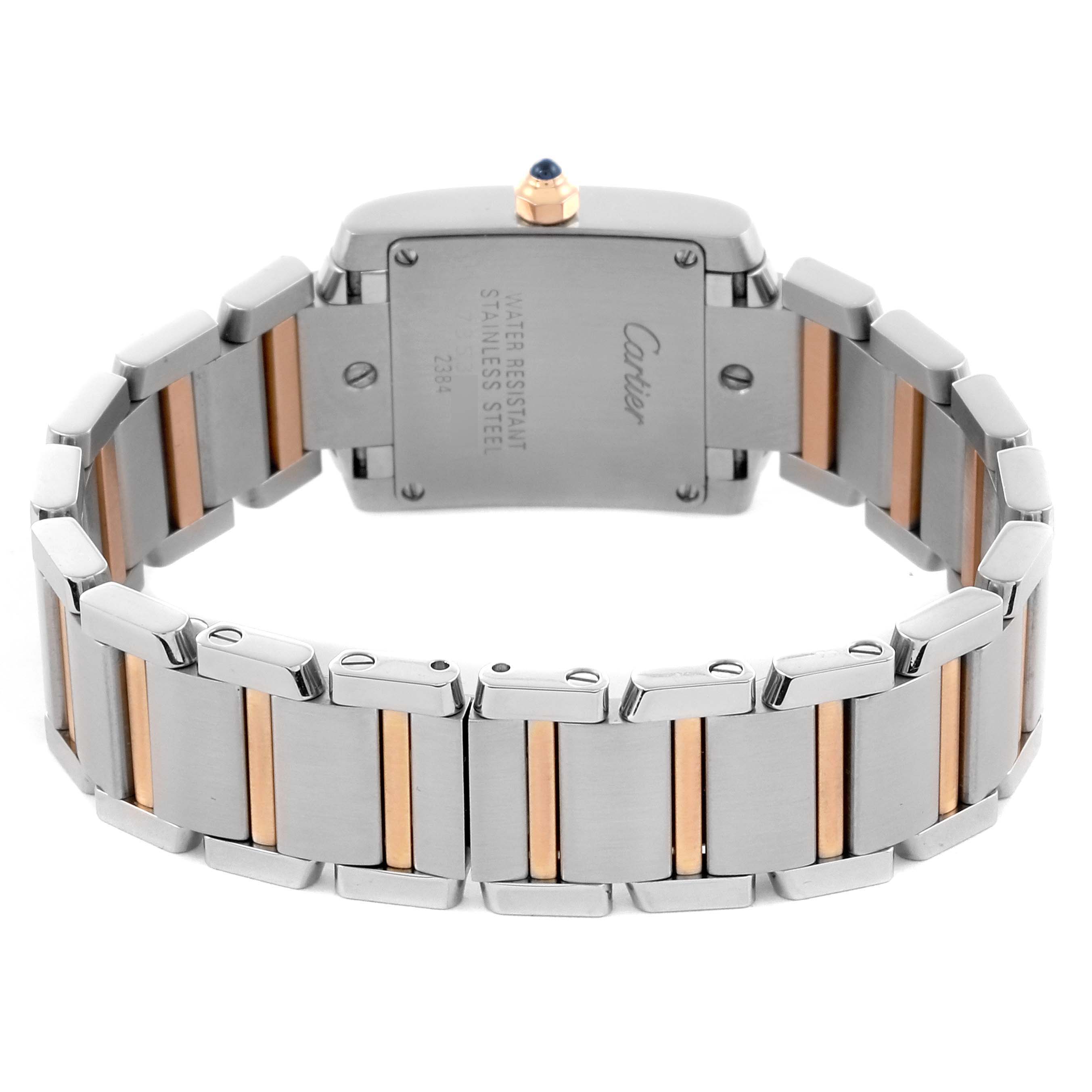 The image shows the back of a Cartier Tank Française watch with a stainless steel and gold bracelet.