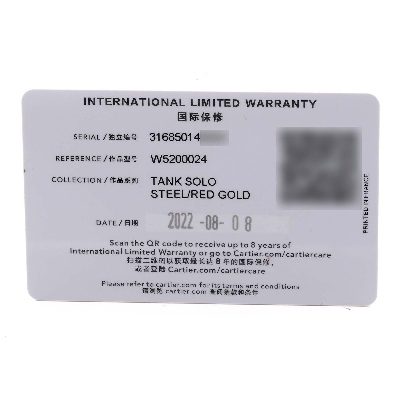 The image shows an international limited warranty card for the Cartier Tank Solo W5200024 Women's Steel and Gold (two tone) Silver Dial W5200024 Women's Steel and Gold (two tone) Silver Dial watch in steel/red gold.