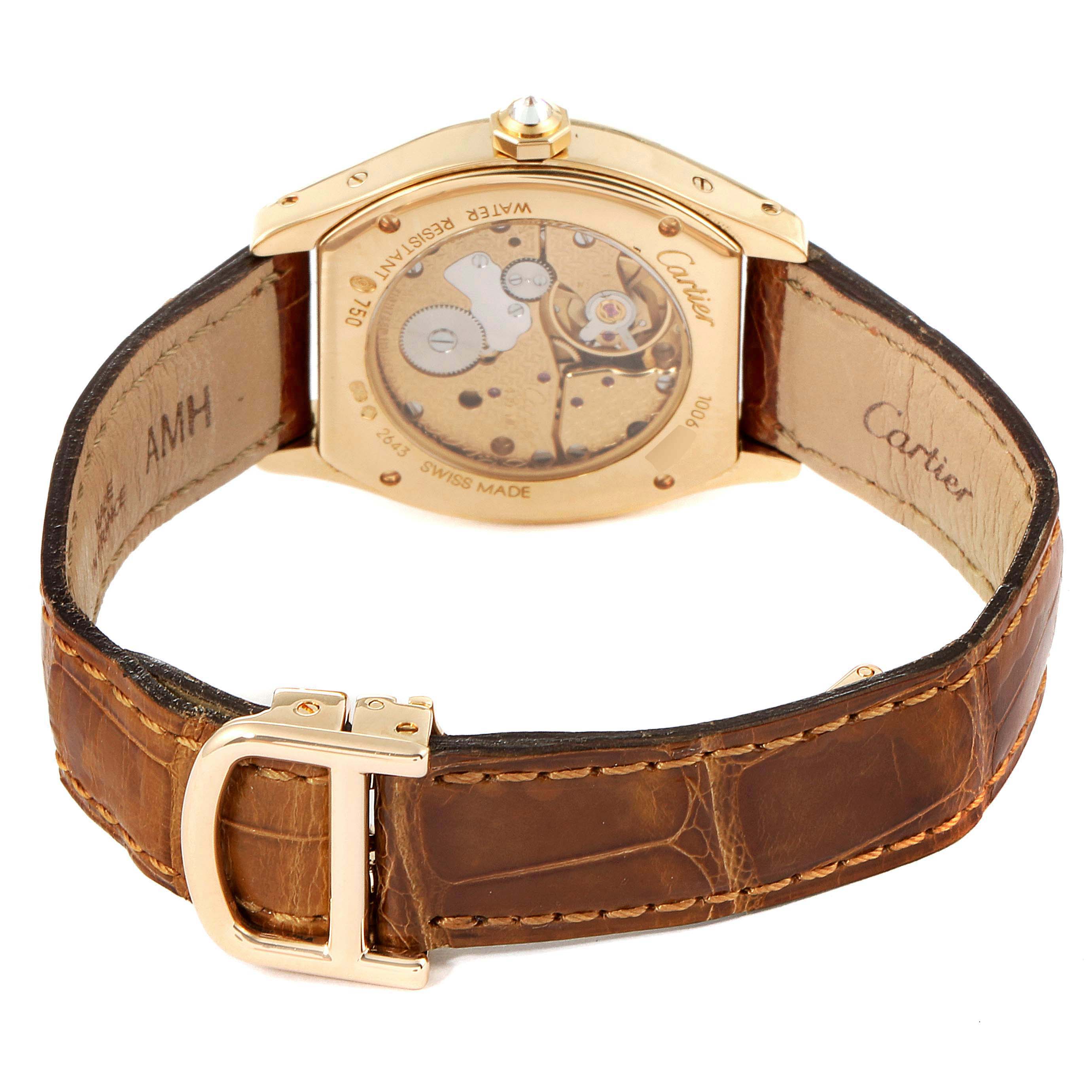 This image shows the back view of a Cartier Tortue WA503751 Women's Yellow Gold Silver Dial WA503751 Women's Yellow Gold Silver Dial watch, revealing its inner mechanism and leather strap.