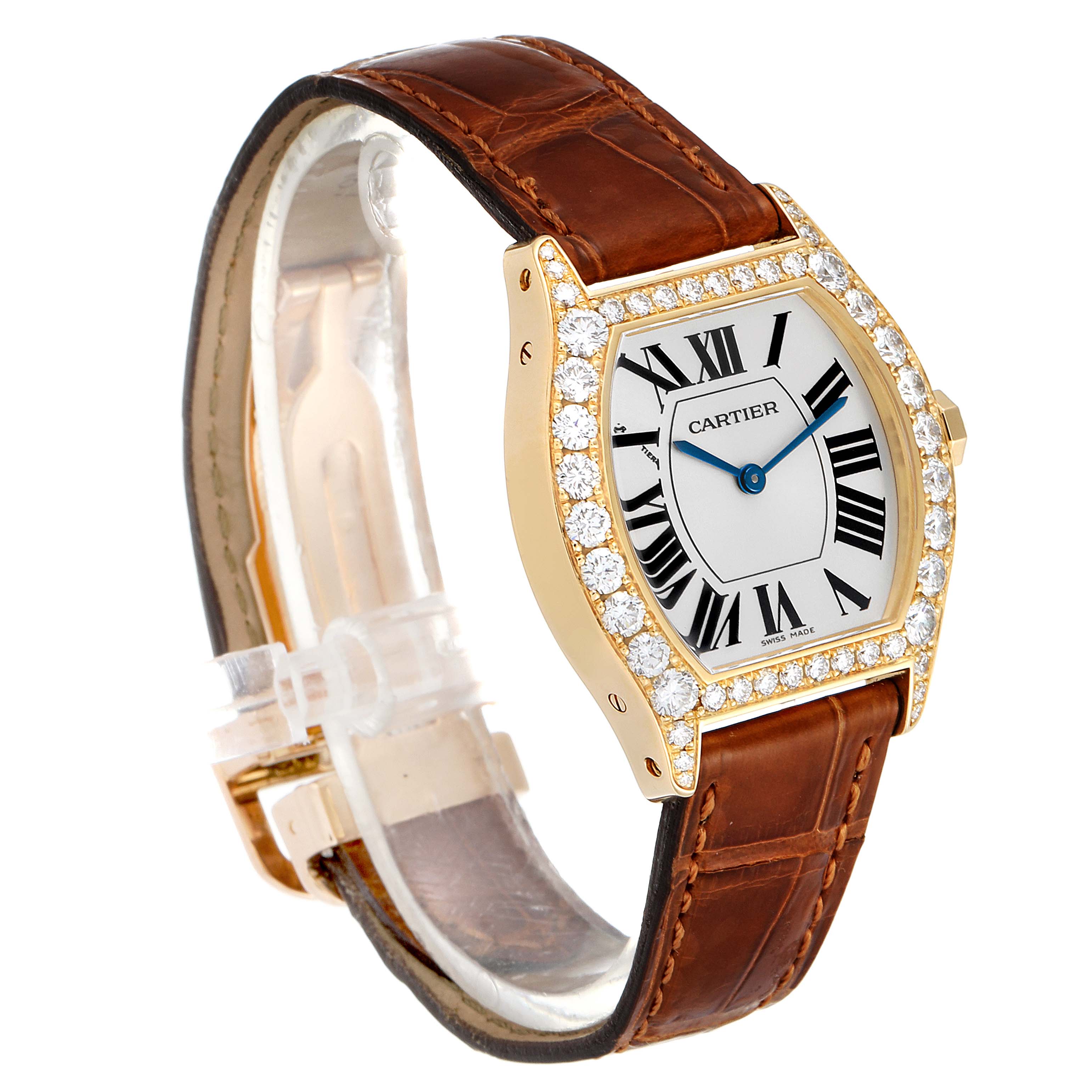 The Cartier Tortue WA503751 Women's Yellow Gold Silver Dial WA503751 Women's Yellow Gold Silver Dial watch is shown at a slight angle, highlighting its diamond-encrusted bezel and brown leather strap.