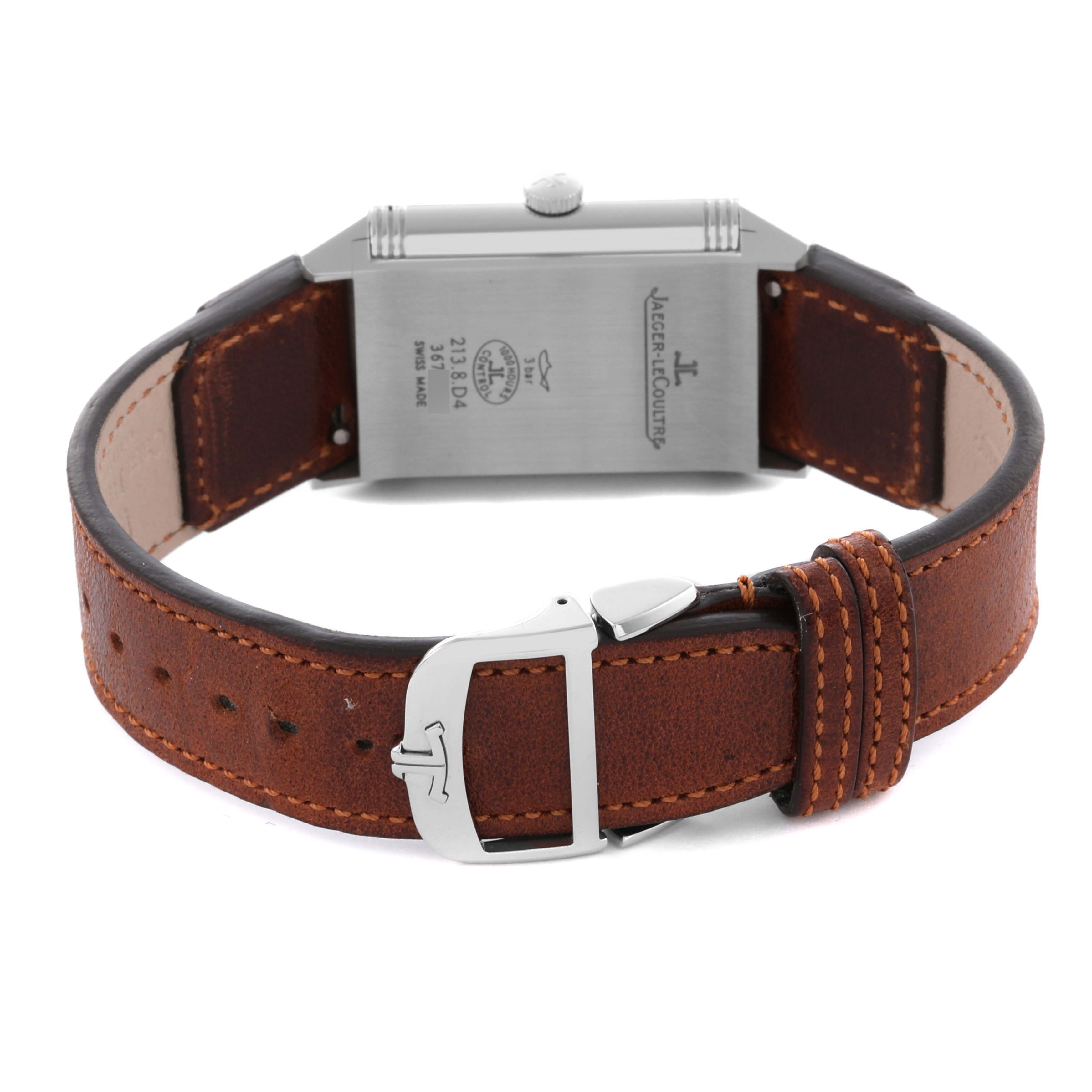 The Jaeger LeCoultre Reverso Q2458422 / 213.8.D4 Men's Stainless Steel Silver Dial Q2458422 / 213.8.D4 Men's Stainless Steel Silver Dial watch is shown from the back, displaying the case back, leather strap, and clasp.