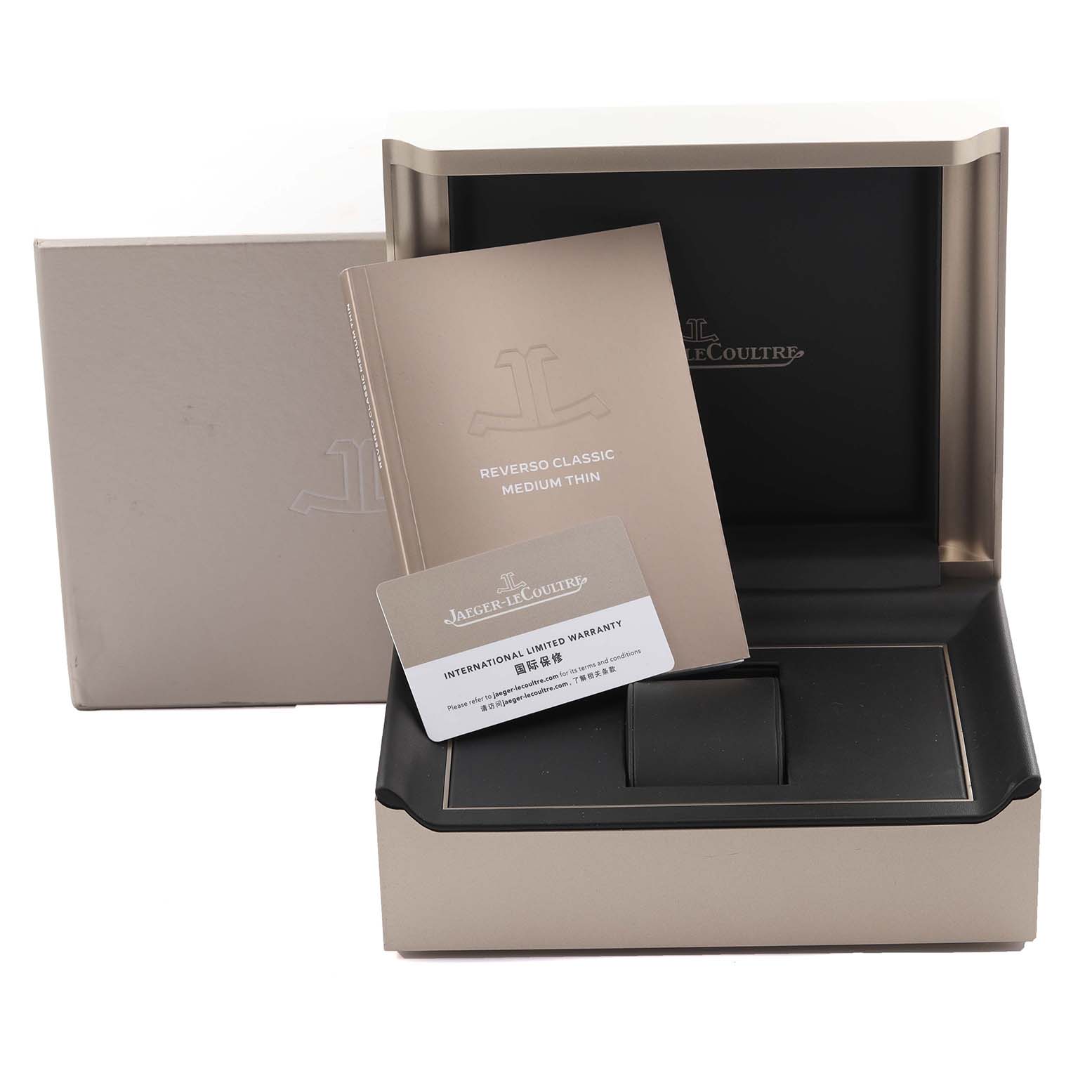The image shows the Jaeger-LeCoultre Reverso box, booklet, and warranty card, viewed from the front.