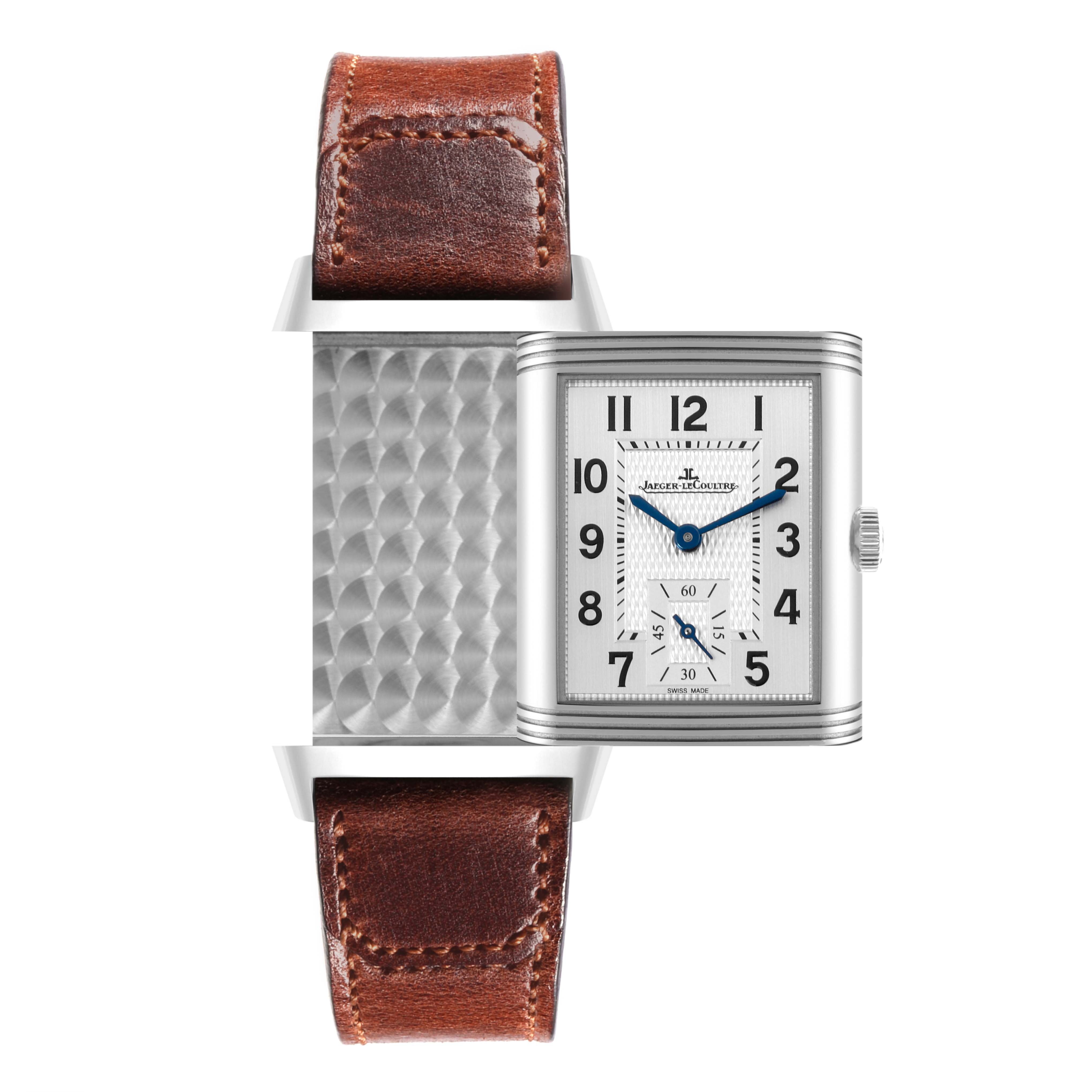 The Jaeger-LeCoultre Reverso watch is shown face-up and partially rotated, displaying both the dial and the back case.