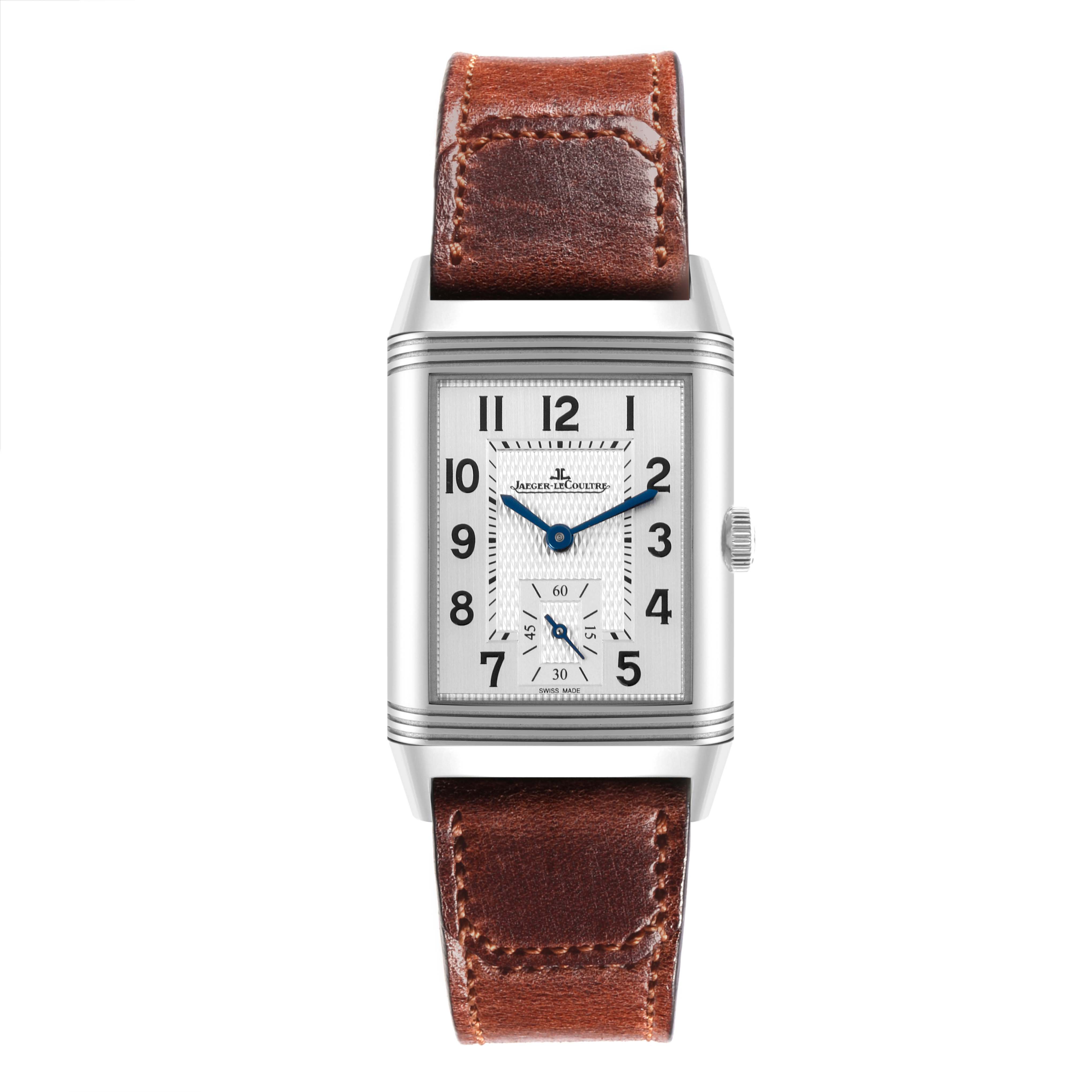 The Jaeger-LeCoultre Reverso watch is shown from the front, highlighting the rectangular dial and brown leather strap.