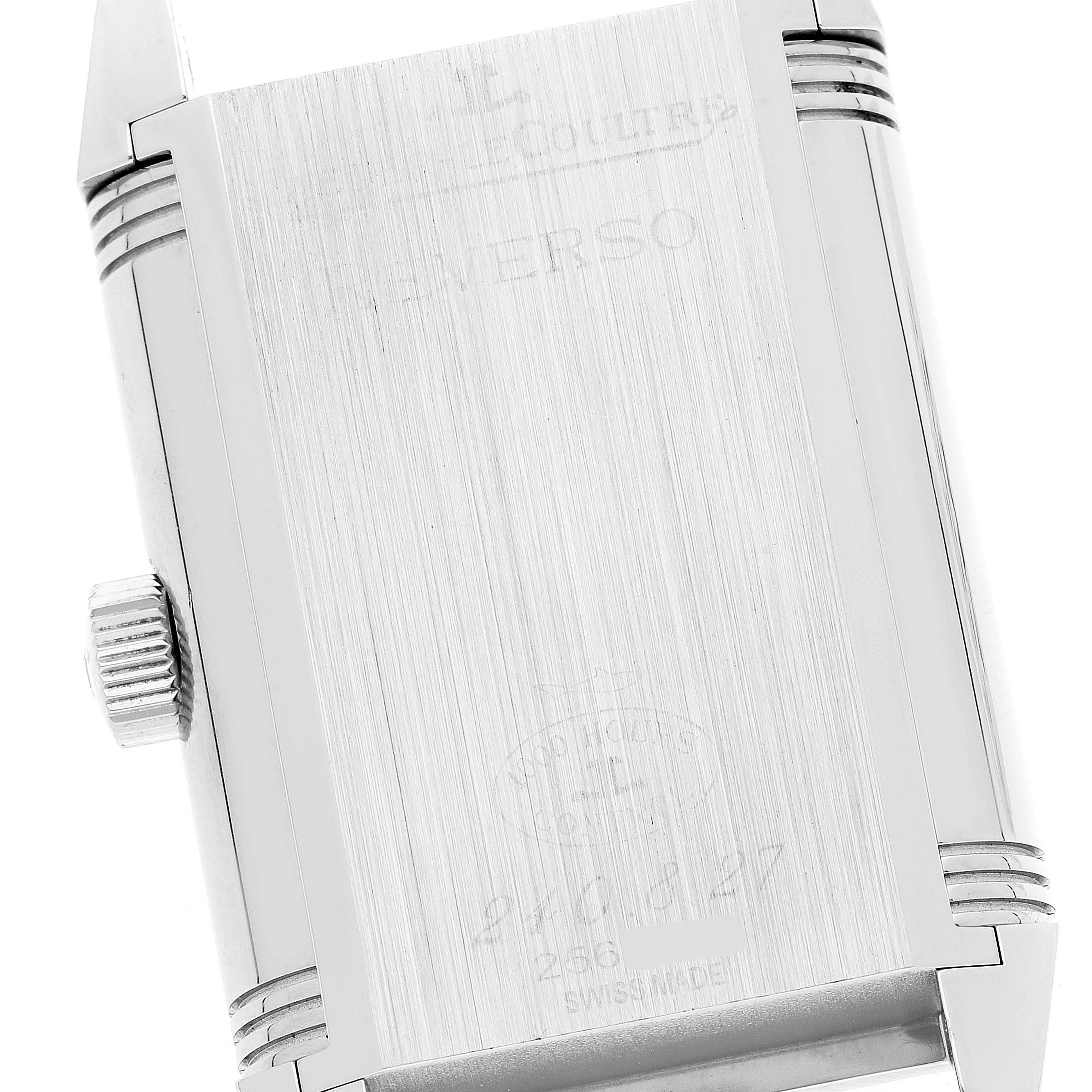 The image shows the back case and crown of a Jaeger-LeCoultre Reverso watch at a slight angle.