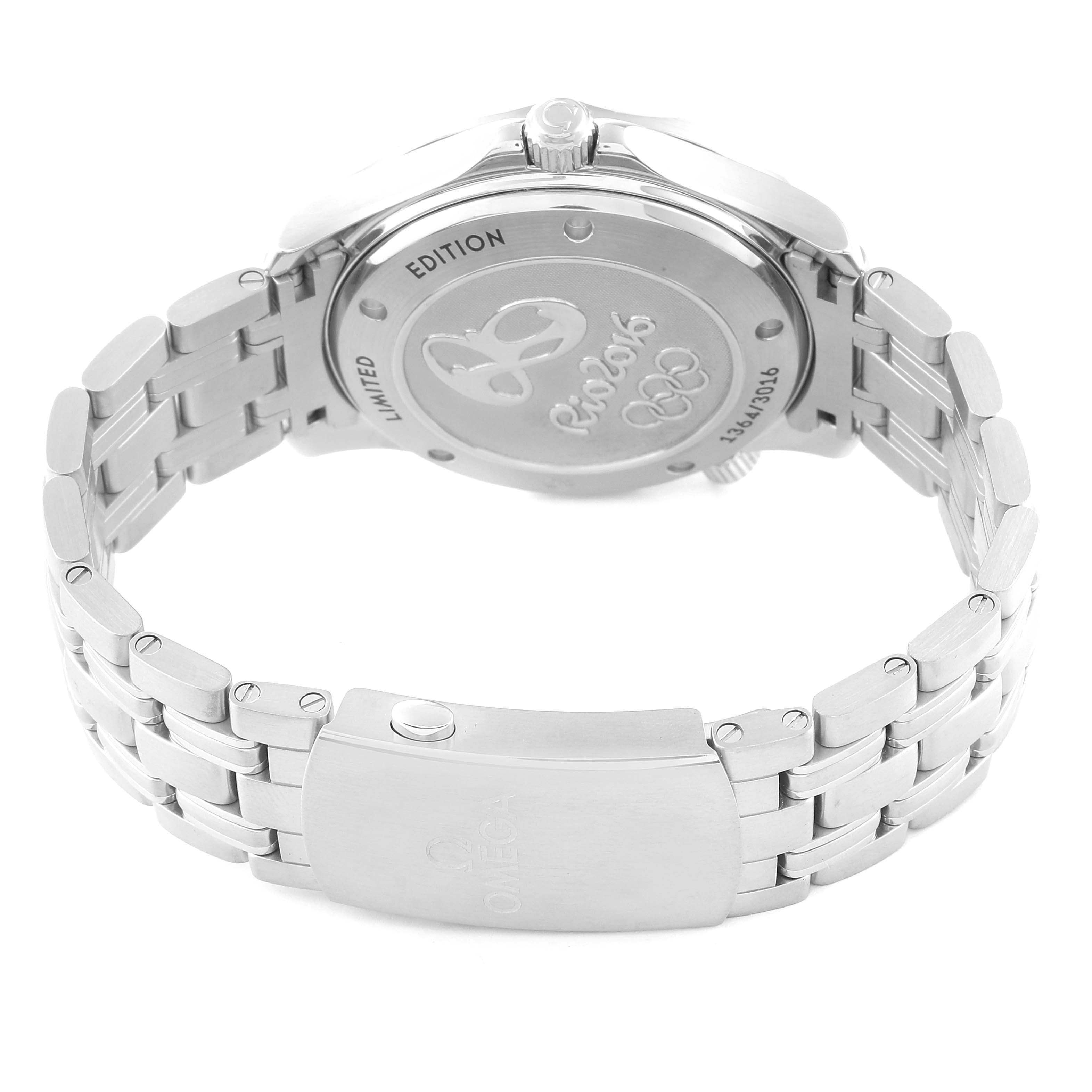 The image shows the back of an Omega Seamaster 522.30.41.20.01.001 Men's Stainless Steel Black Dial watch, highlighting the case back with "Rio 2016" engraving and the metal bracelet.