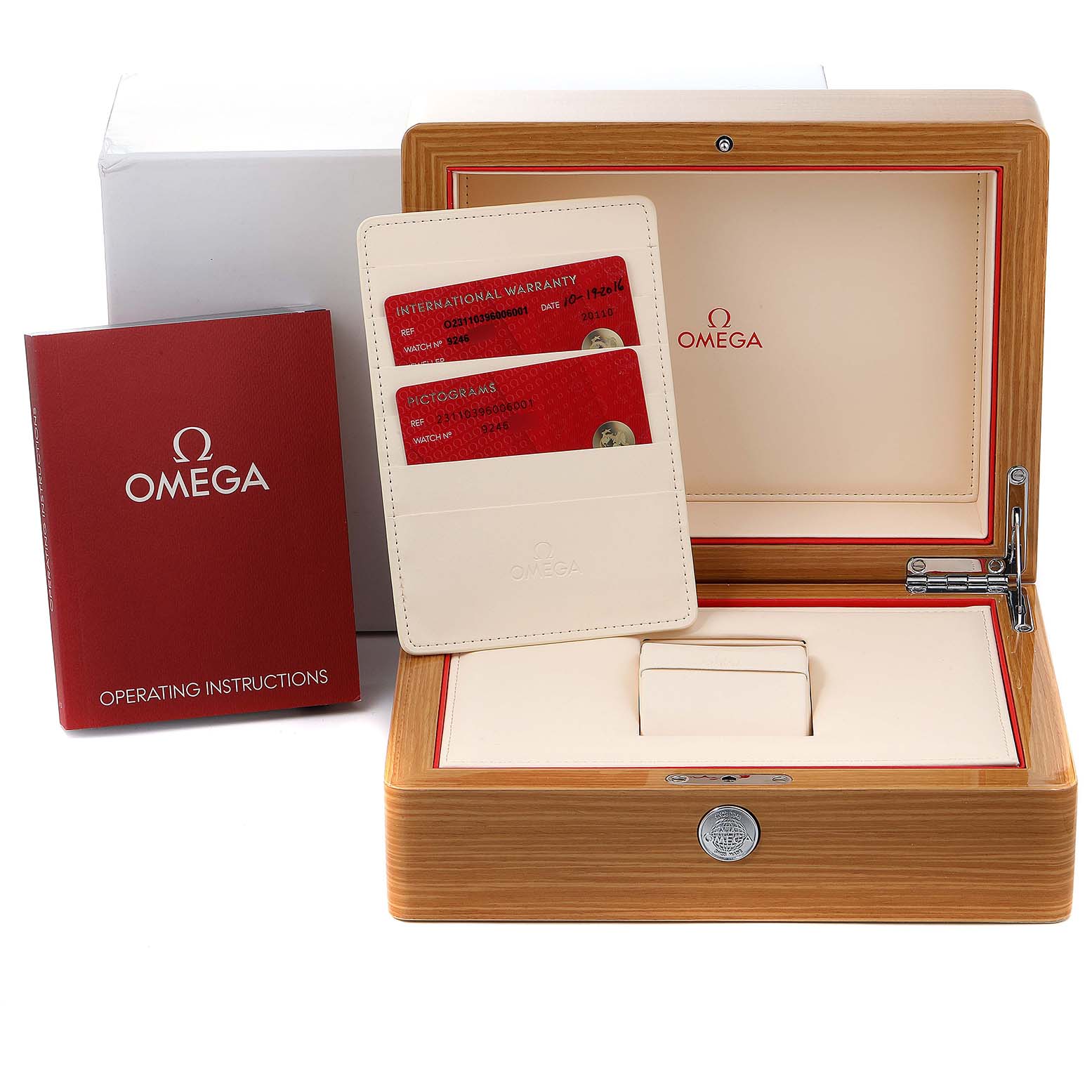 This image shows the Aqua Terra model by Omega's packaging, including the wooden box, operating instructions, and warranty cards.