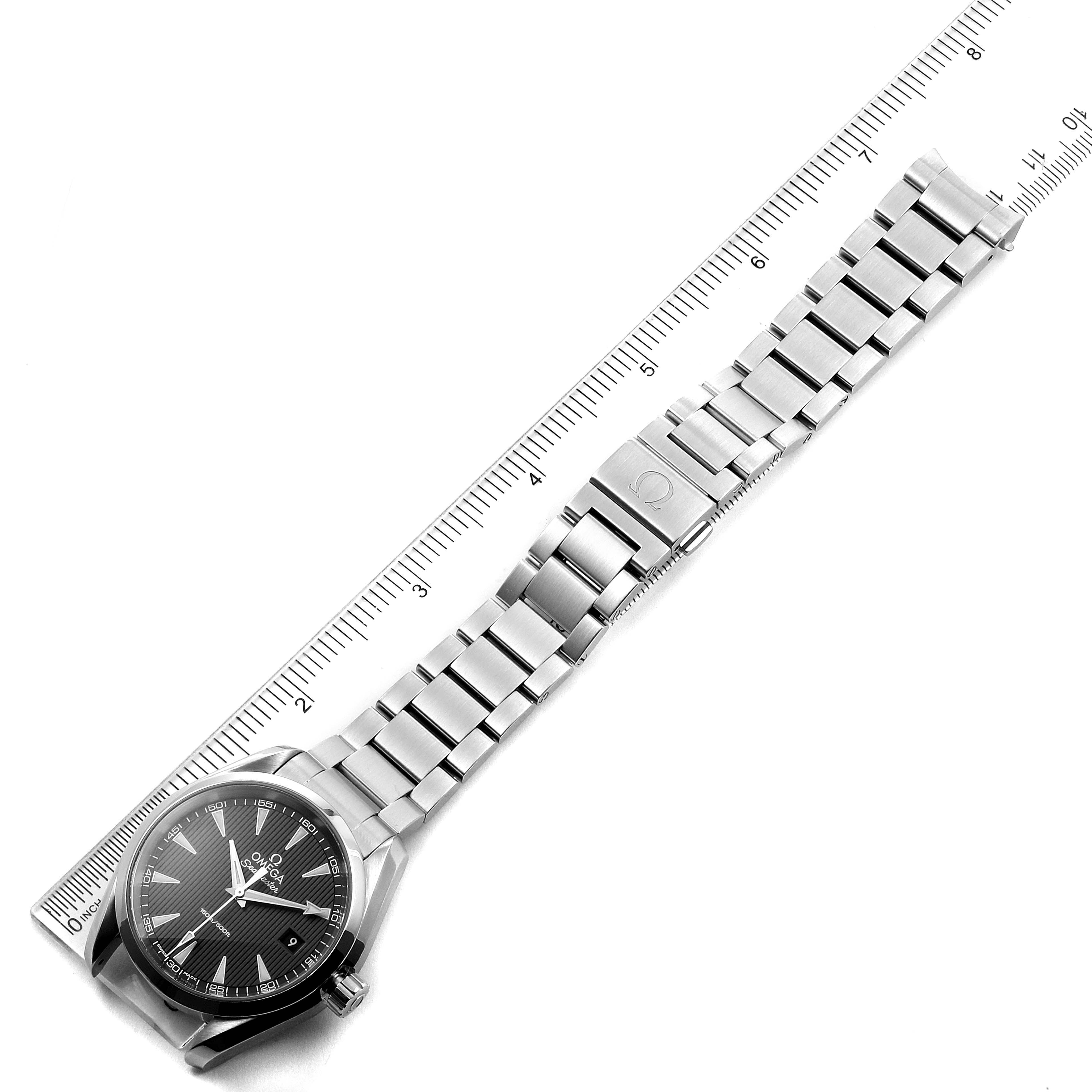 The image shows a top-down view of an Omega Aqua Terra 231.10.39.60.06.001 Men's Stainless Steel Grey Dial 231.10.39.60.06.001 Men's Stainless Steel Grey Dial watch, including the face, band, and clasp, aligned with a ruler.