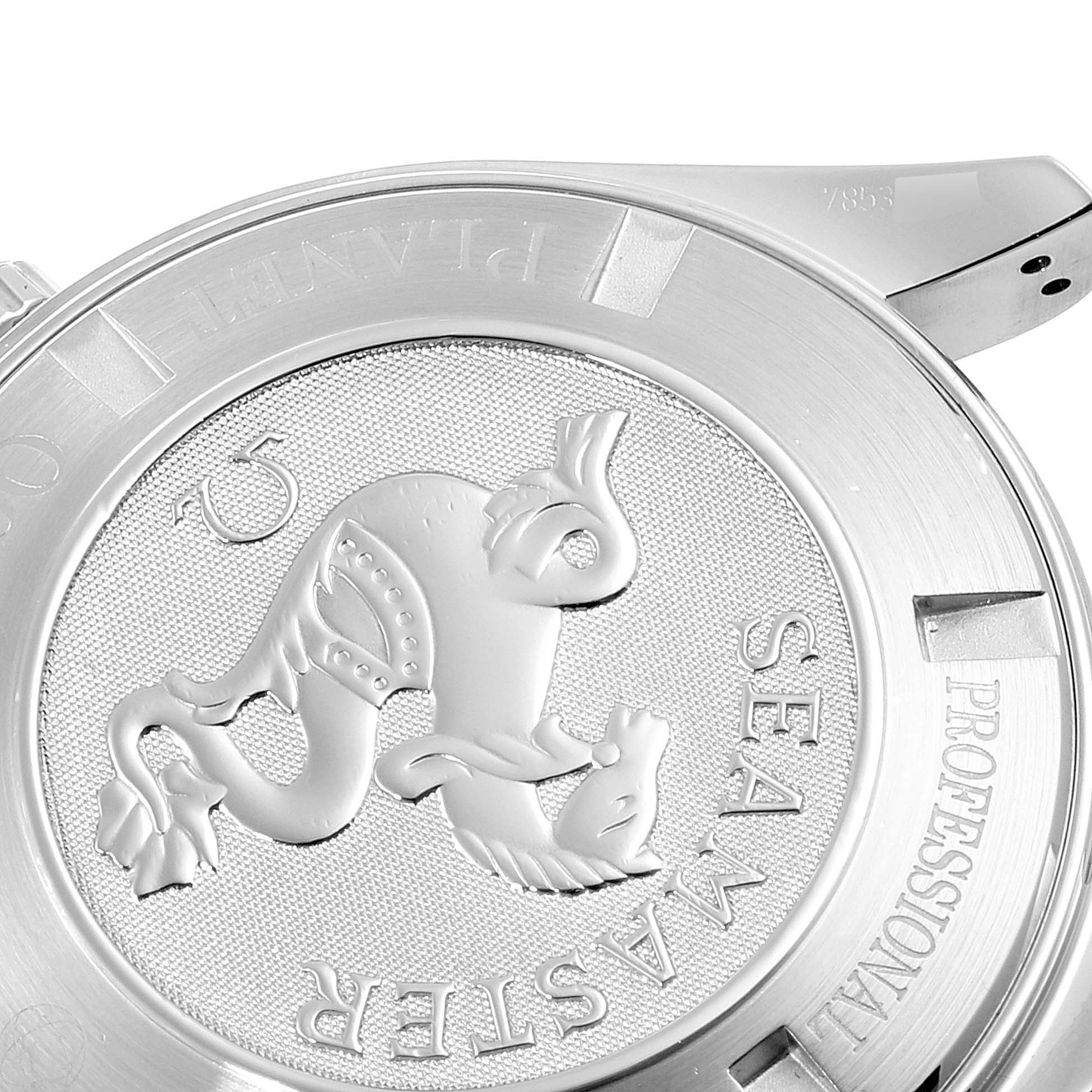 This image shows the case back of the Omega Planet Ocean 2210.51.00 Men's Stainless Steel Black Dial 2210.51.00 Men's Stainless Steel Black Dial model watch, featuring engravings and a seahorse emblem.