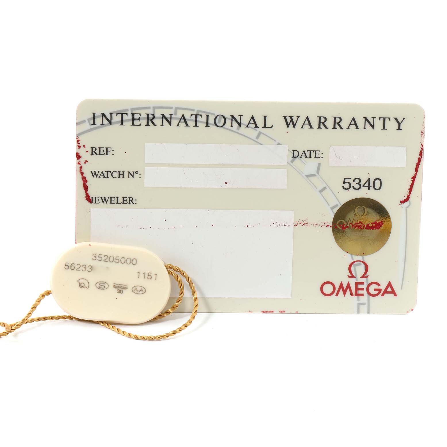 The image shows an International Warranty card and a tag for an Omega Speedmaster 3520.50.00 Men's Stainless Steel Black Dial 3520.50.00 Men's Stainless Steel Black Dial watch.
