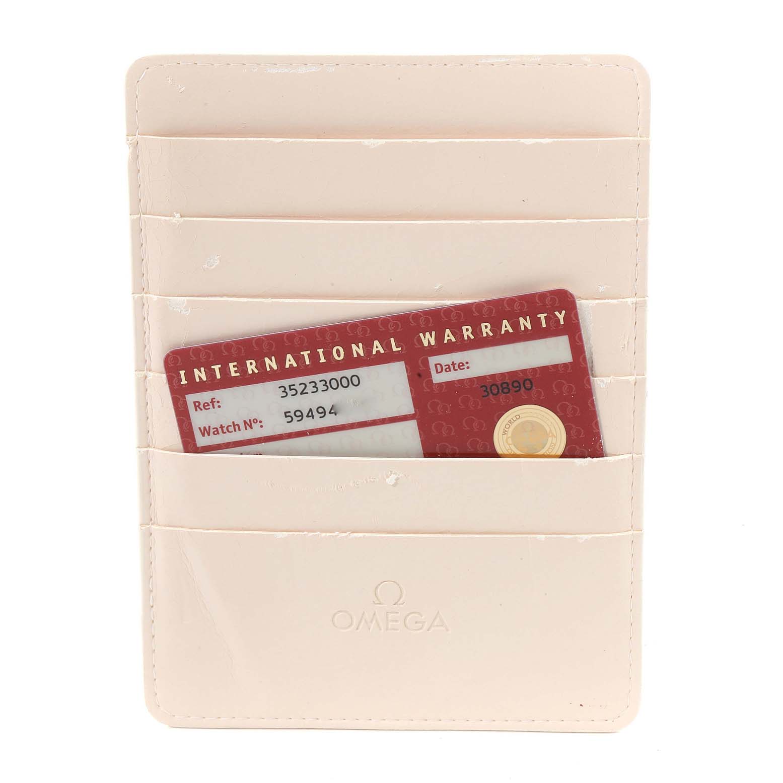 The image shows the international warranty card and cardholder for an Omega Speedmaster 3523.30.00 Men's Stainless Steel Silver Dial 3523.30.00 Men's Stainless Steel Silver Dial watch.