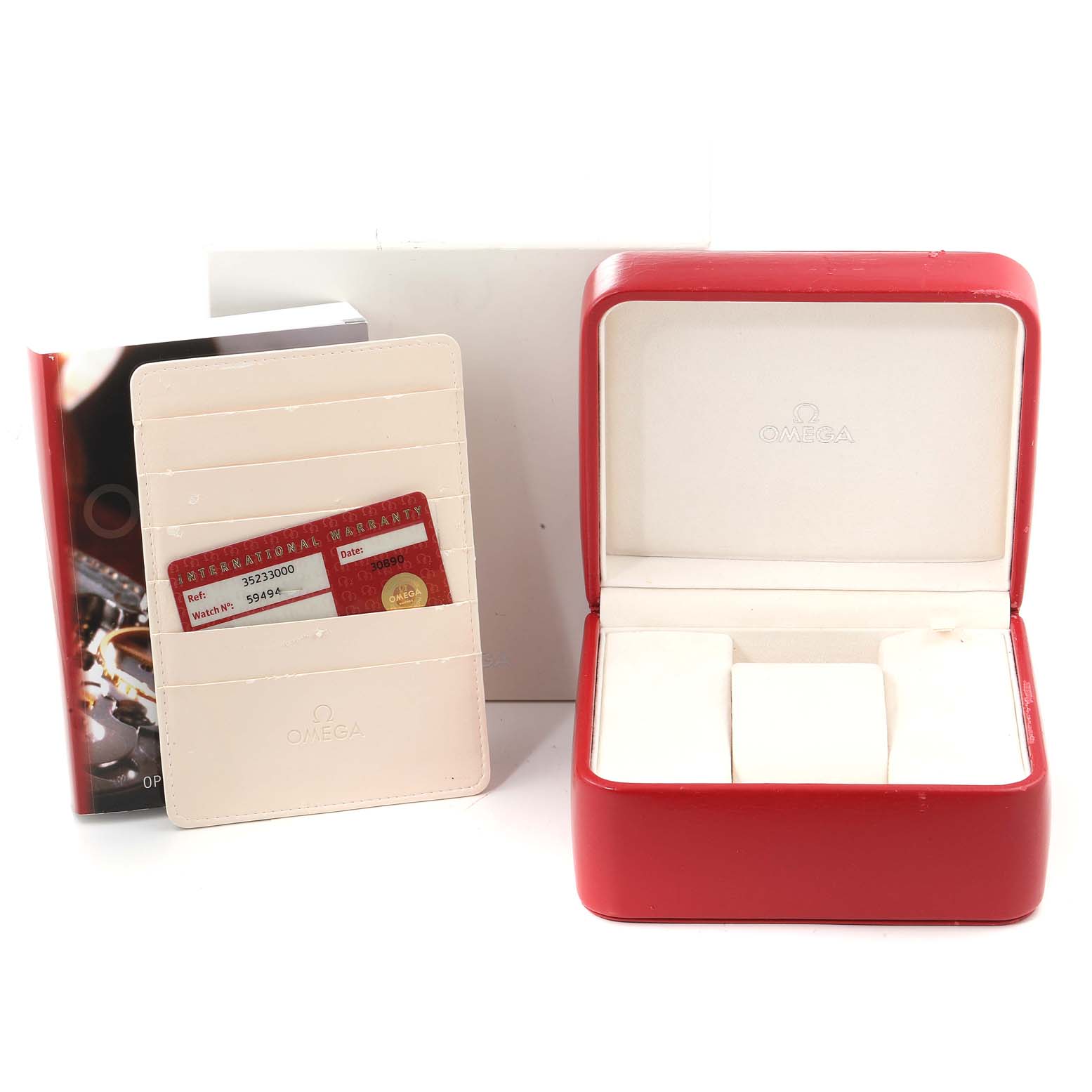 The image displays the Omega Speedmaster 3523.30.00 Men's Stainless Steel Silver Dial 3523.30.00 Men's Stainless Steel Silver Dial's red watch box, warranty cards, and accompanying booklet from a front angle.