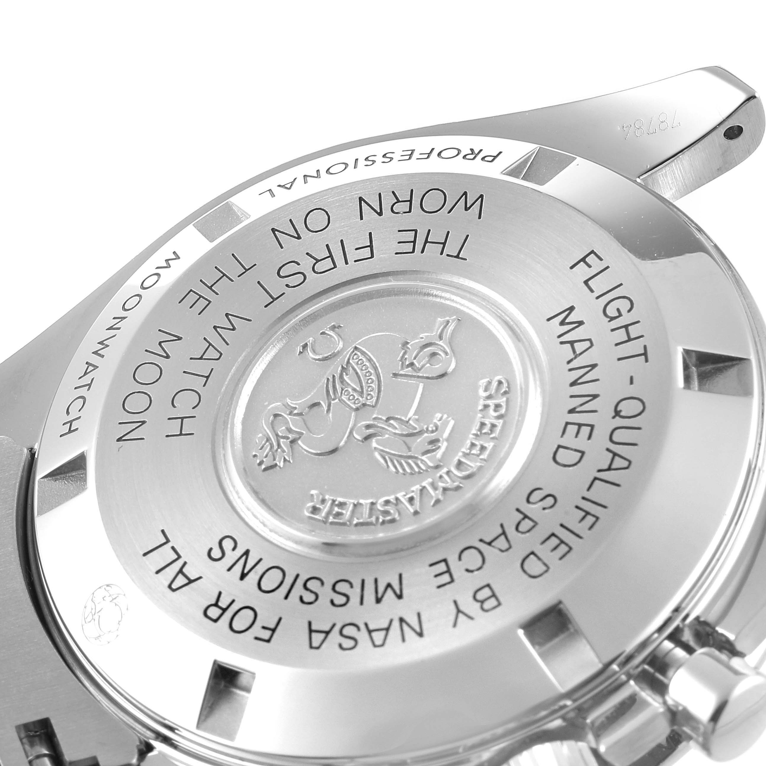 This image shows the engraved case back of an Omega Speedmaster 311.30.42.30.01.005 Men's Stainless Steel Black Dial 311.30.42.30.01.005 Men's Stainless Steel Black Dial watch at a slight angle.