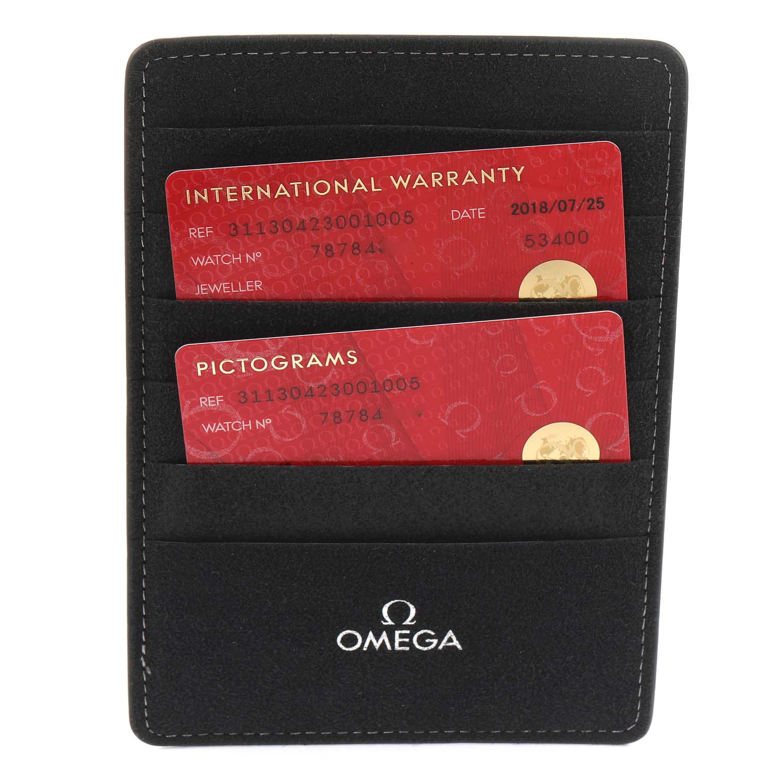 The image shows an Omega Speedmaster 311.30.42.30.01.005 Men's Stainless Steel Black Dial 311.30.42.30.01.005 Men's Stainless Steel Black Dial model warranty and pictogram cards in a black Omega cardholder.