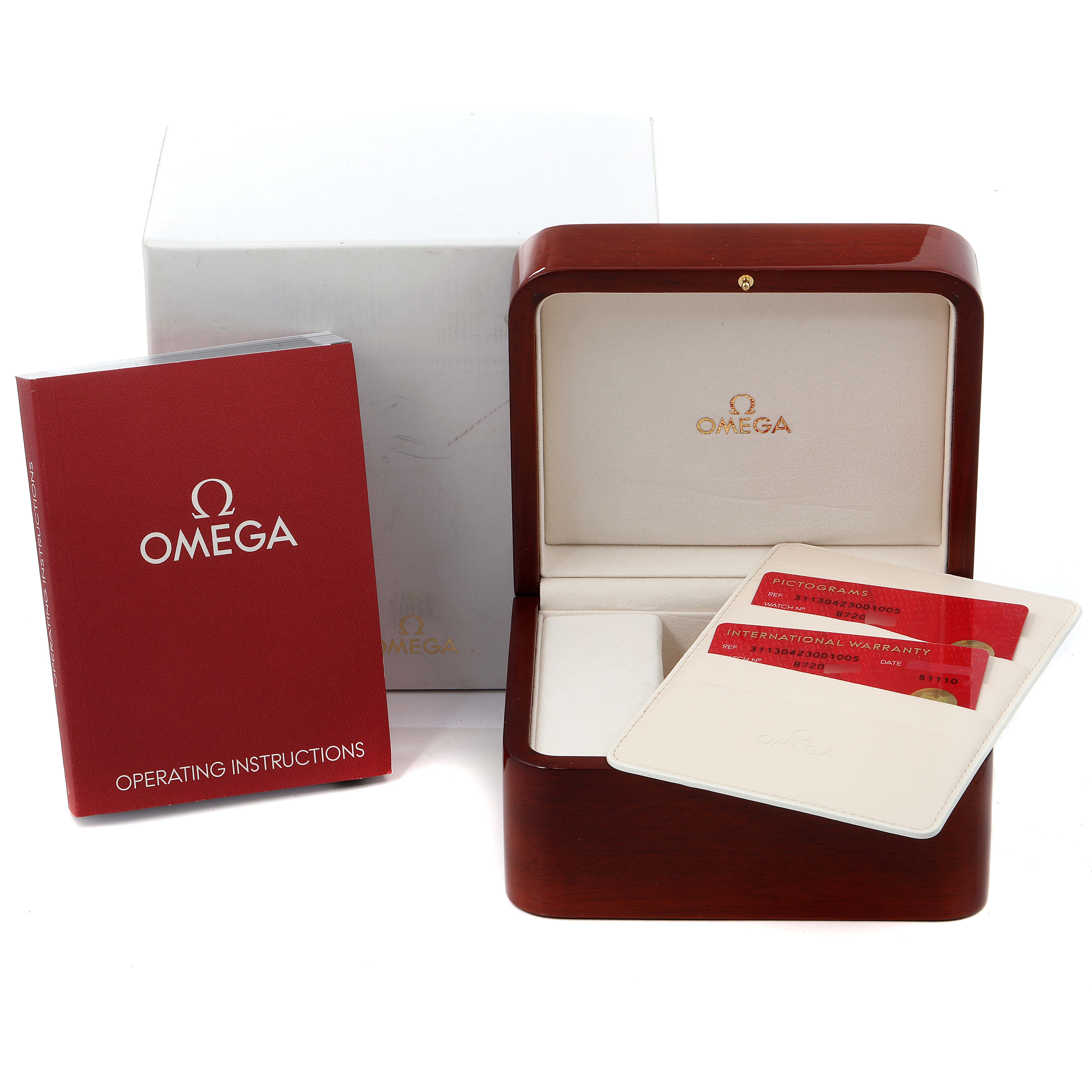 The image shows the Omega Speedmaster 311.30.42.30.01.005 Men
s Stainless Steel Black Dial 311.30.42.30.01.005 Men
s Stainless Steel Black Dial watch
s box, instruction manual, and warranty cards from a front angle.