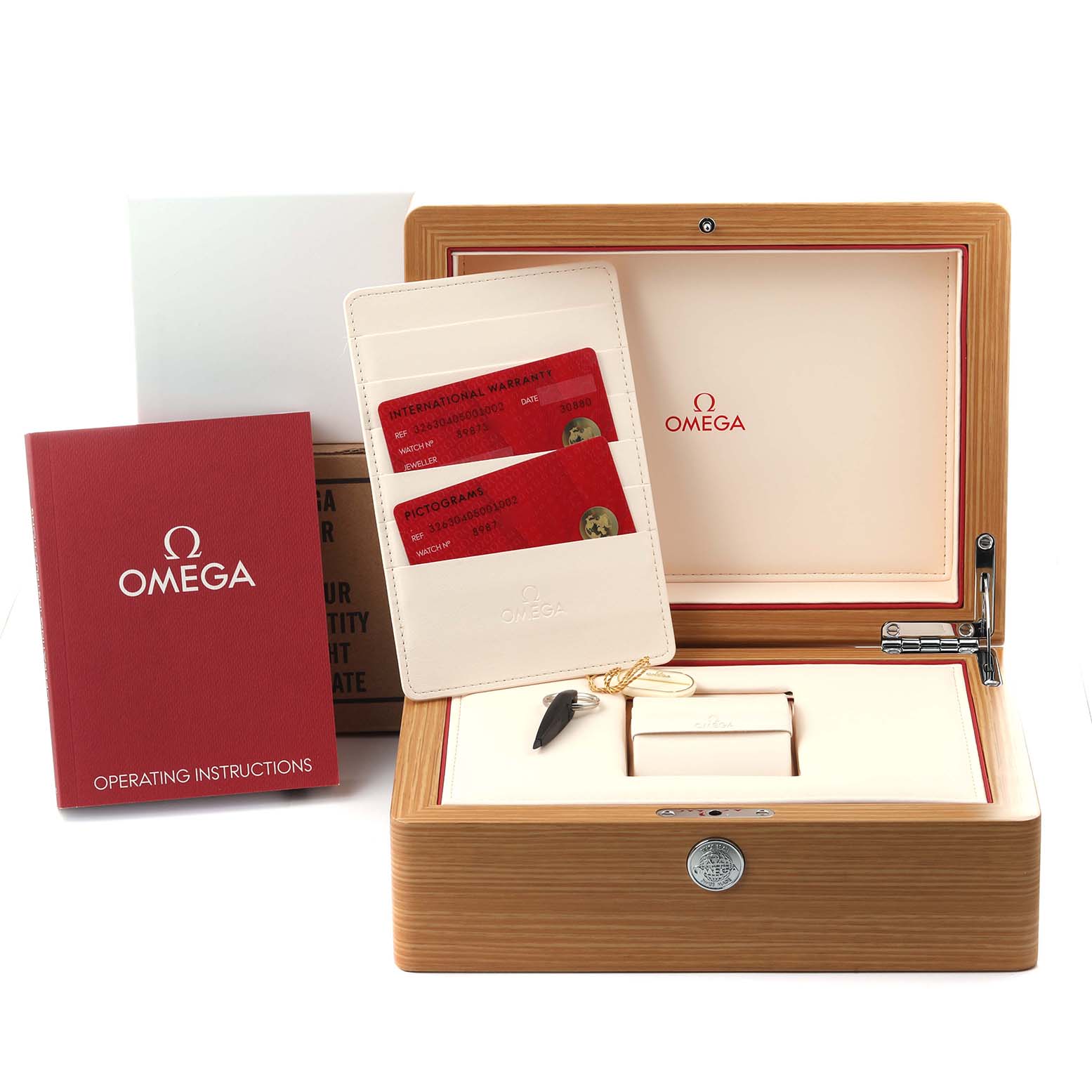 The Omega Speedmaster 326.30.40.50.01.002 Men's Stainless Steel Black Dial 326.30.40.50.01.002 Men's Stainless Steel Black Dial accessories shown include a box, manuals, a cardholder with cards, and a loupe.