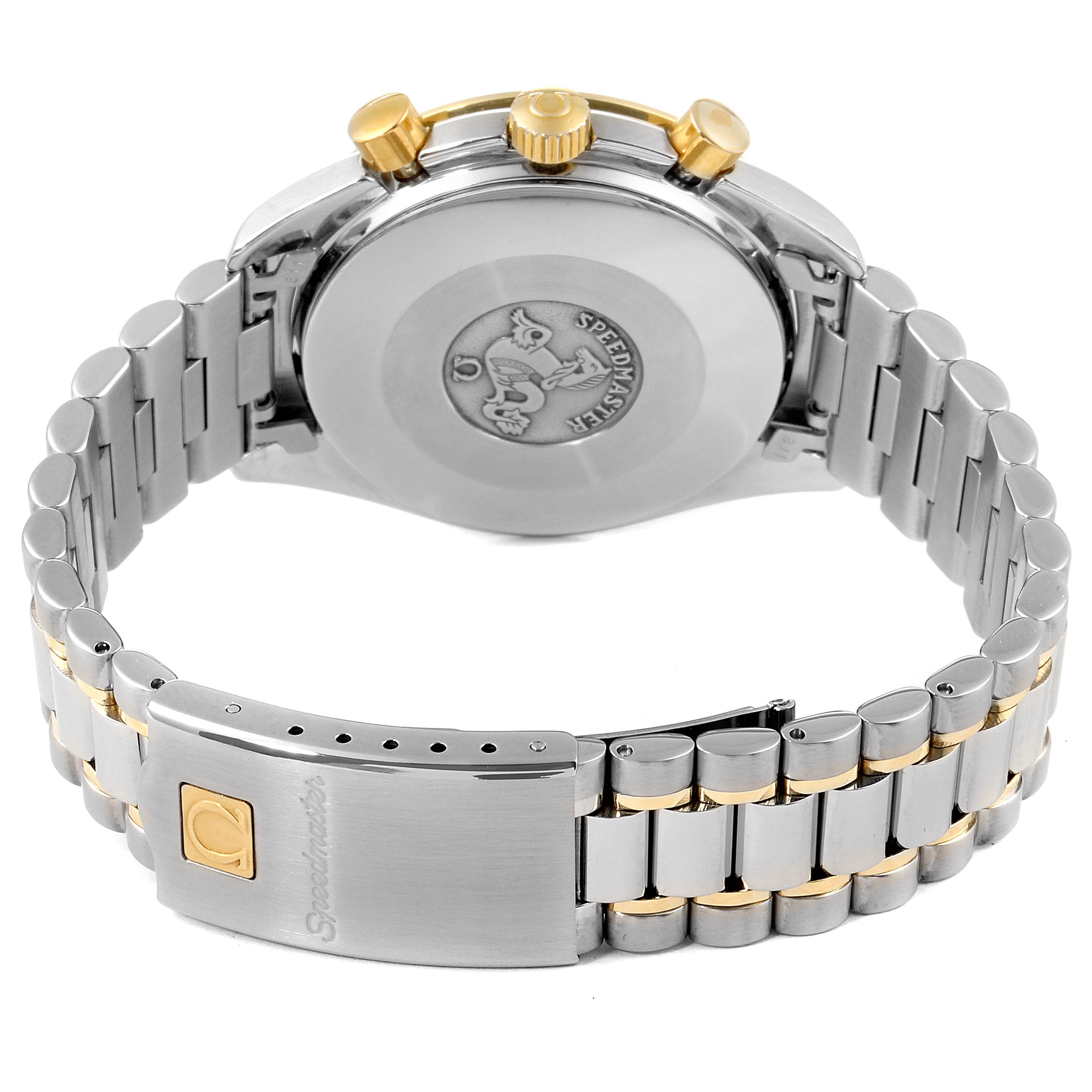 The image shows the back view of an Omega Speedmaster 3310.20.00 Men's Steel and Gold (two tone) White Dial 3310.20.00 Men's Steel and Gold (two tone) White Dial watch, highlighting its case, crown, and clasp with bracelet links.