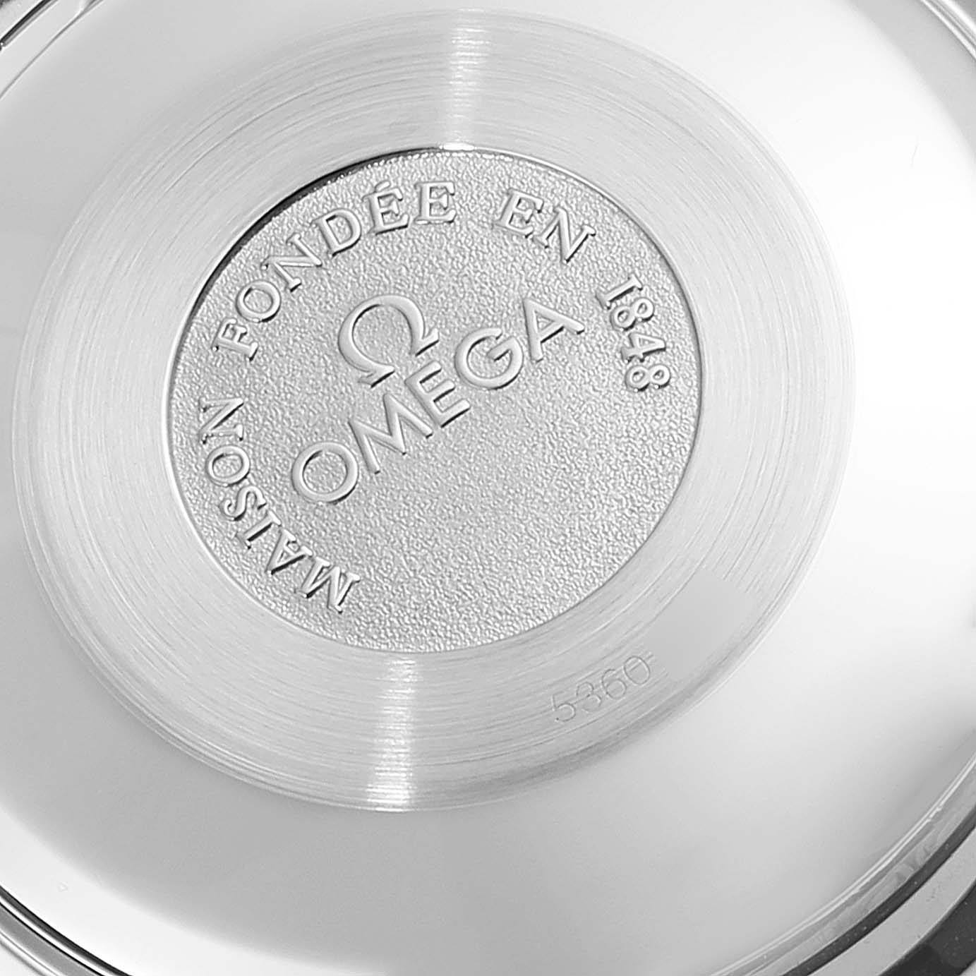 This is a close-up image of the back case of an Omega Speedmaster 3330.20.00 Men's Steel and Gold (two tone) White Dial 3330.20.00 Men's Steel and Gold (two tone) White Dial watch, showing its model and brand inscription.