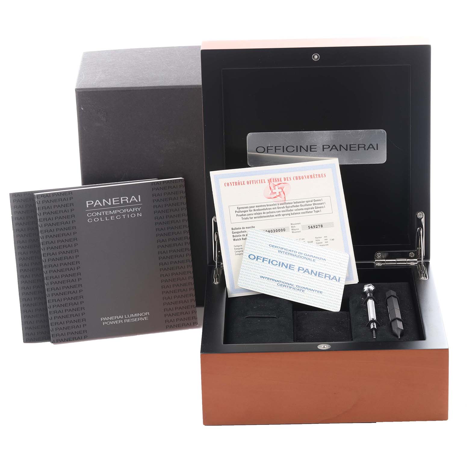 The image shows the packaging and accessories for a Panerai Luminor PAM00090 Men's Stainless Steel Black Dial PAM00090 Men's Stainless Steel Black Dial model, including documentation, tool, and black strap.