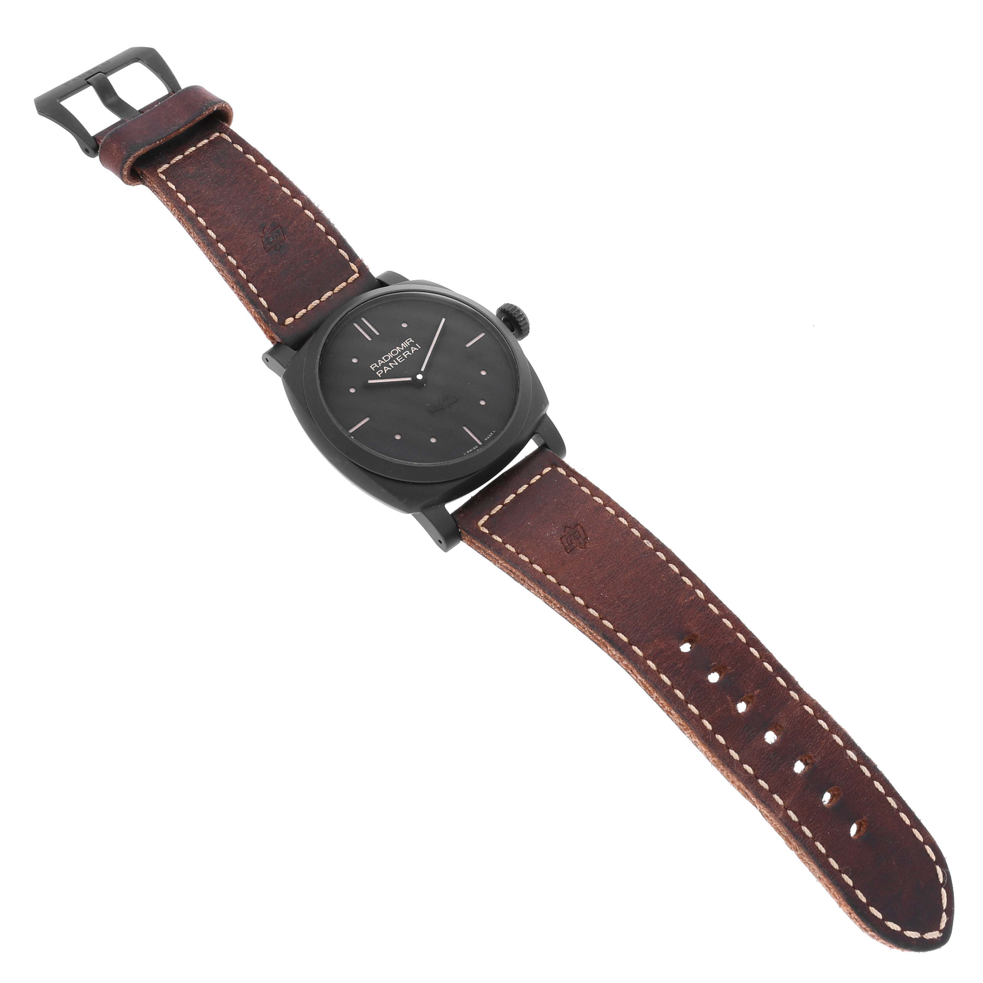 The Panerai Radiomir PAM00577 Men
s Ceramic Black Dial PAM00577 Men
s Ceramic Black Dial watch is shown from a top-down angle, featuring its case, dial, and brown leather strap.
