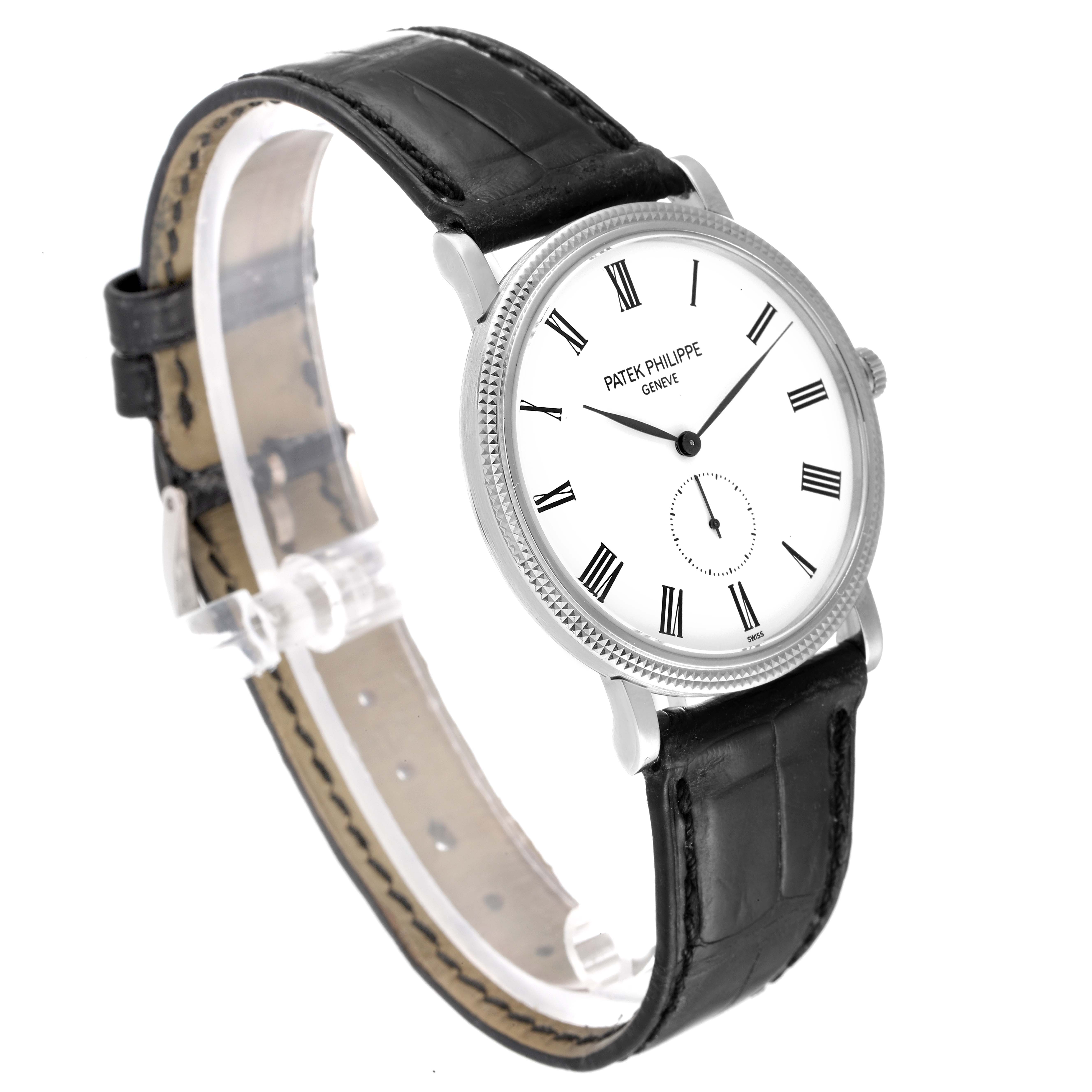 The image shows a side angle view of the Patek Philippe Calatrava 5119G Men's White Gold White Dial 5119G Men's White Gold White Dial watch, highlighting its face, bezel, and leather strap.