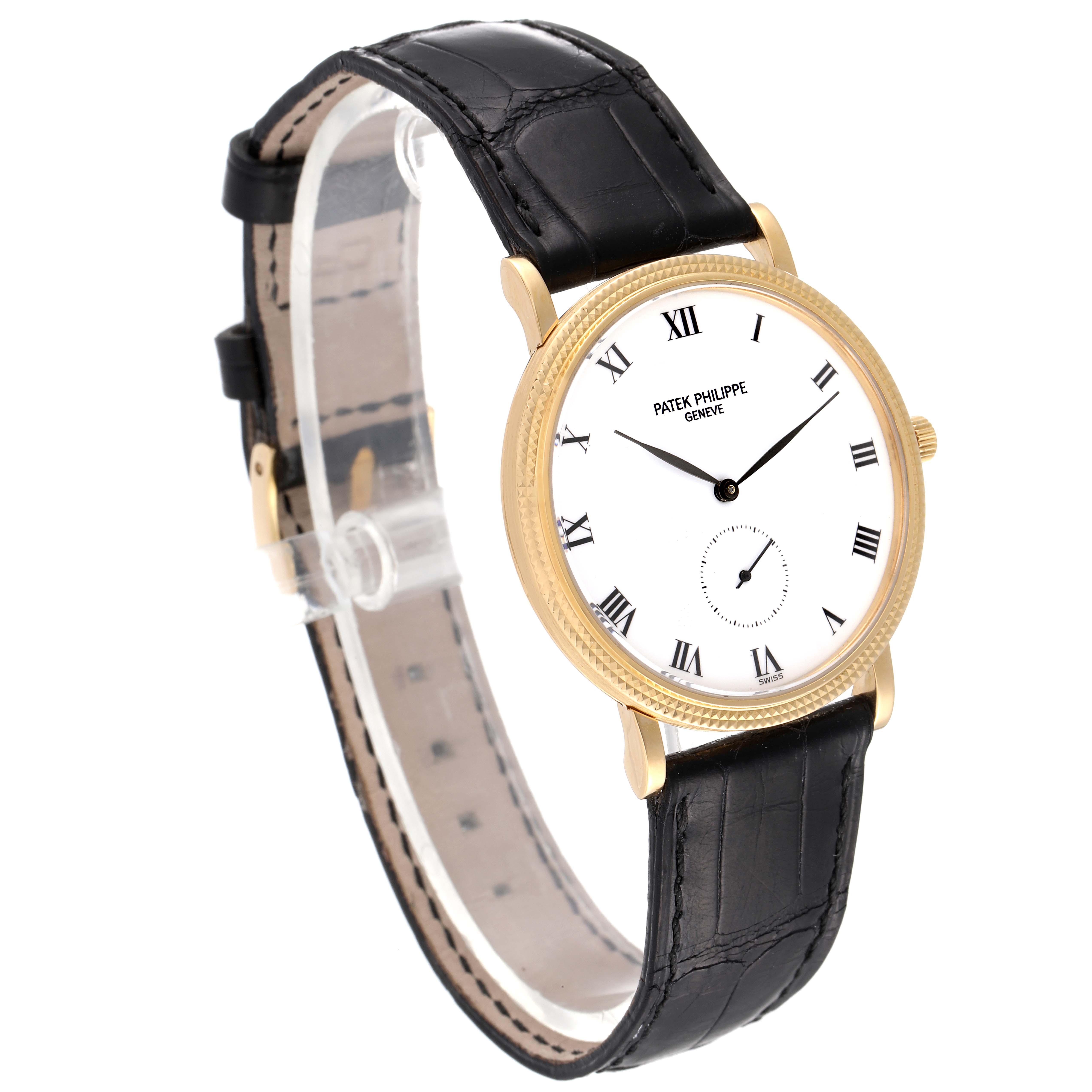 The image shows a side angle view of a Patek Philippe Calatrava 3919 Men's Yellow Gold White Dial 3919 Men's Yellow Gold White Dial watch, highlighting its gold case, white dial, and black leather strap.