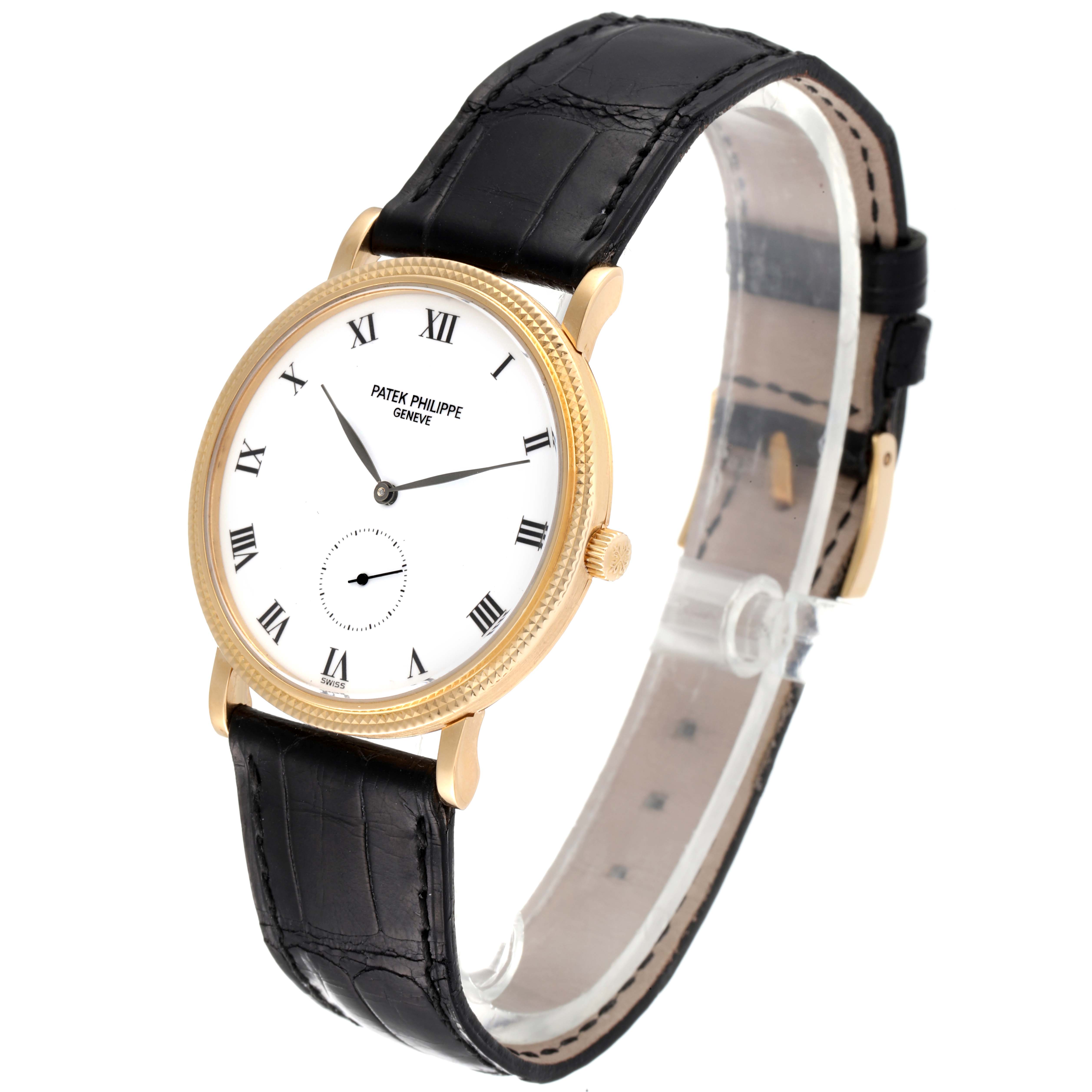 This image shows a Patek Philippe Calatrava 3919 Men's Yellow Gold White Dial 3919 Men's Yellow Gold White Dial watch from a 3/4 angle, highlighting its dial, case, crown, and black leather strap.