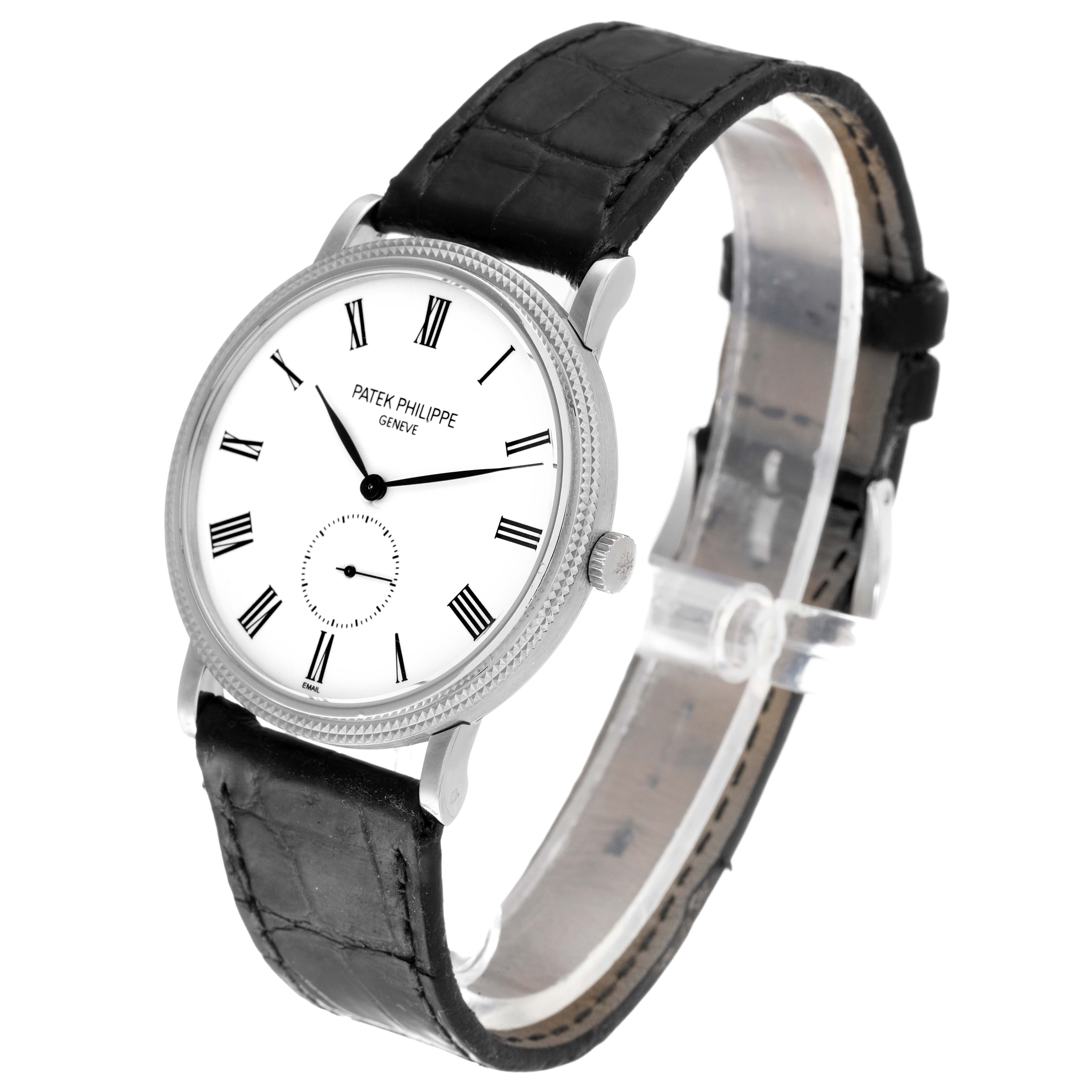 This image shows a Patek Philippe Calatrava 5116G Men's White Gold White Dial 5116G Men's White Gold White Dial watch at a slight angle, displaying its face, black strap, and side crown.