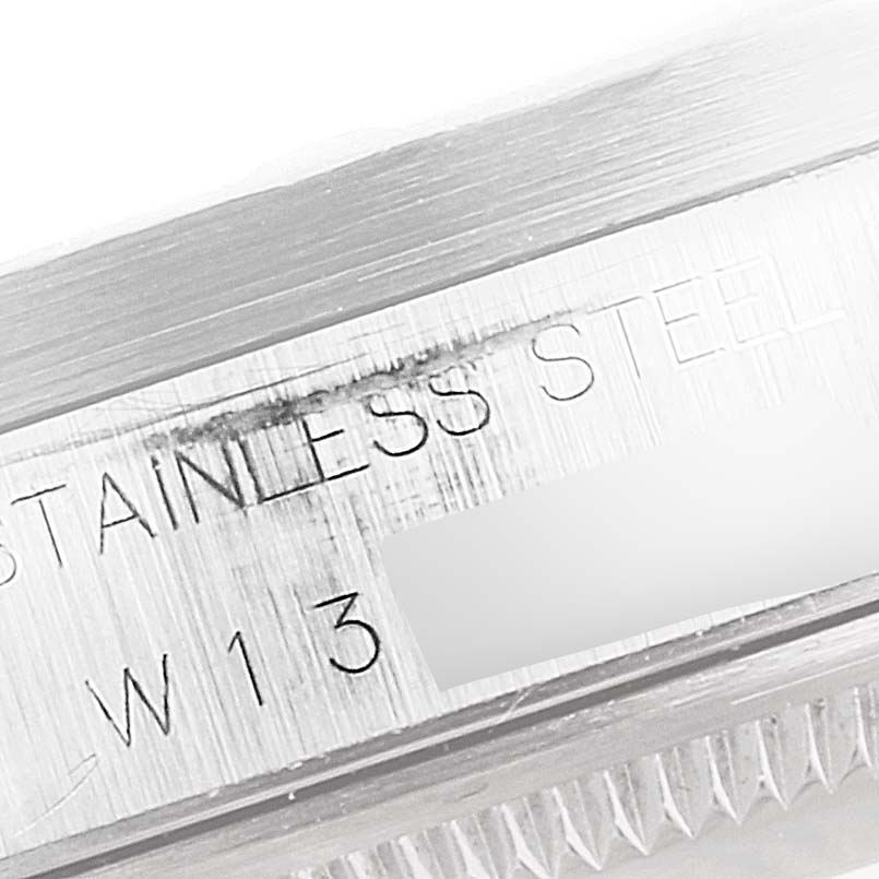 The image shows the inscription on the side of a Rolex Air-King 30891 Men's Stainless Steel White Dial 30891 Men's Stainless Steel White Dial watch case, featuring the text "STAINLESS STEEL."