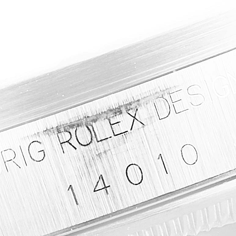 This close-up image shows the engraved model number 14010 on the case of a Rolex Air-King 30891 Men's Stainless Steel White Dial 30891 Men's Stainless Steel White Dial watch.