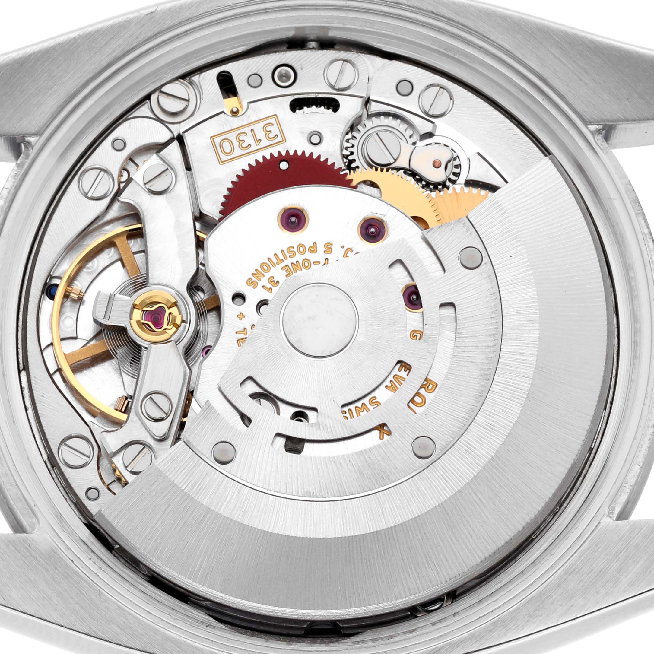 The Rolex Air-King 114210 Men's Stainless Steel Silver Dial 114210 Men's Stainless Steel Silver Dial watch is shown from the back, revealing its intricate mechanical movement.