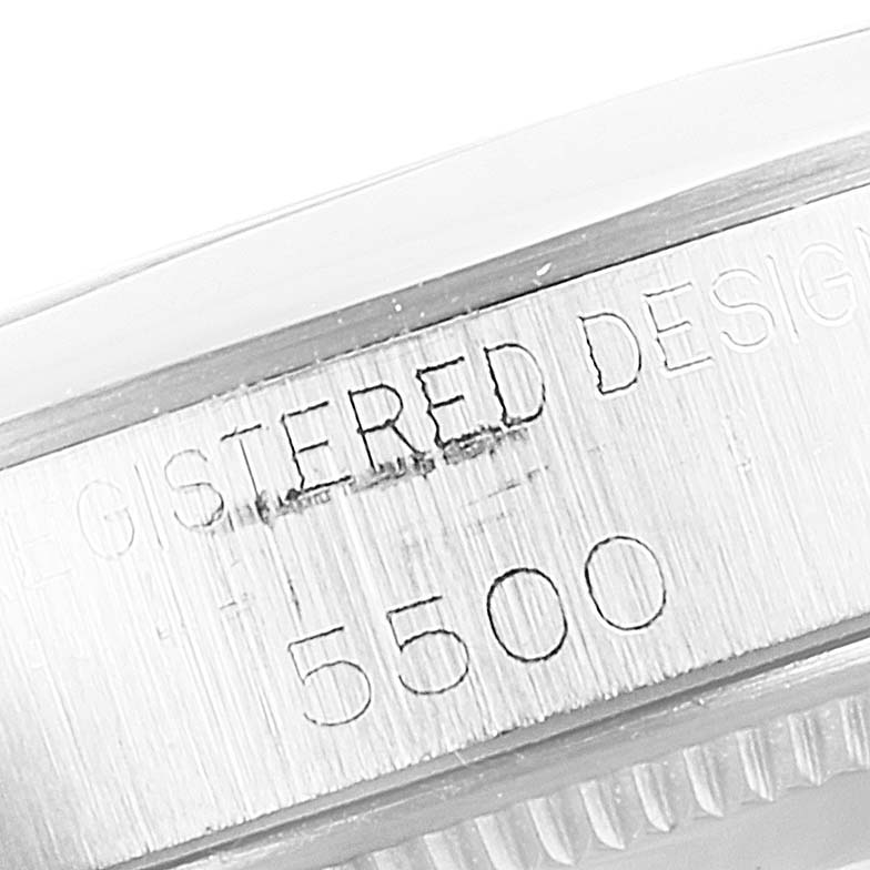 This image shows a close-up of the side of a Rolex Vintage Collection 5500 Men's Stainless Steel Silver Dial 5500 Men's Stainless Steel Silver Dial watch model 5500, revealing the engraved text.