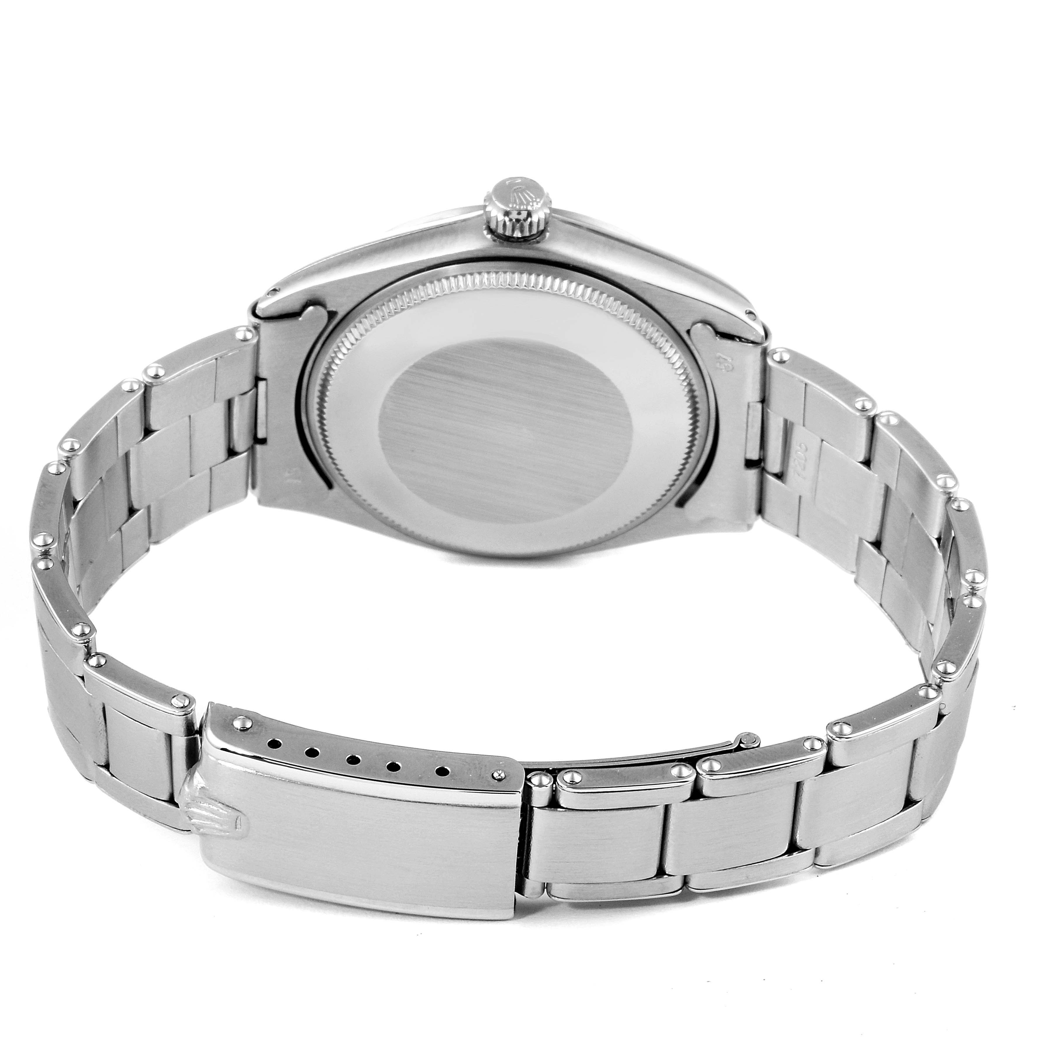 The image shows the back view of a Rolex Vintage Collection 5500 Men's Stainless Steel Silver Dial 5500 Men's Stainless Steel Silver Dial model, focusing on the case back, crown, and bracelet.