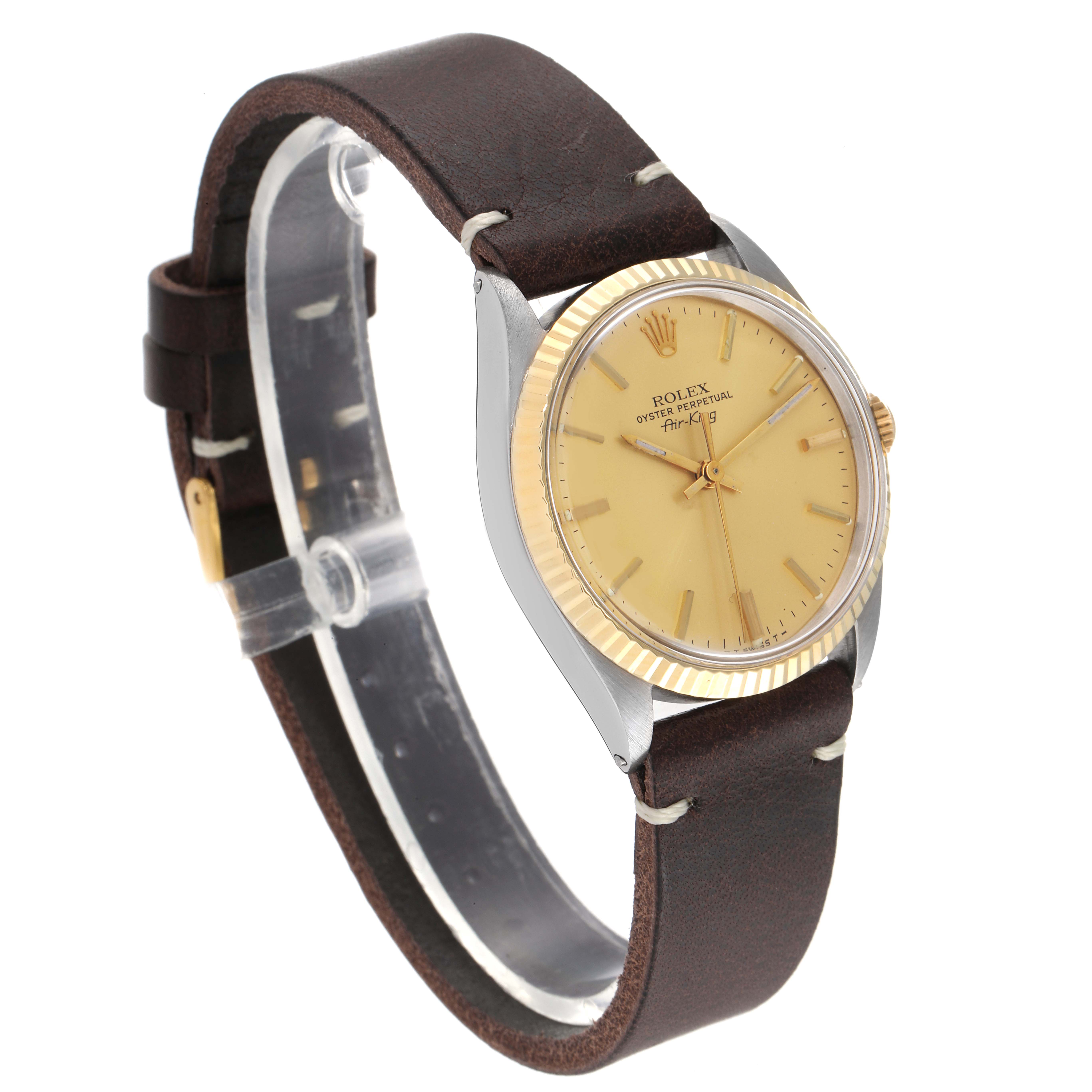 The Vintage Collection Rolex watch is shown from an angled side view, highlighting the dial, bezel, case, and leather strap.